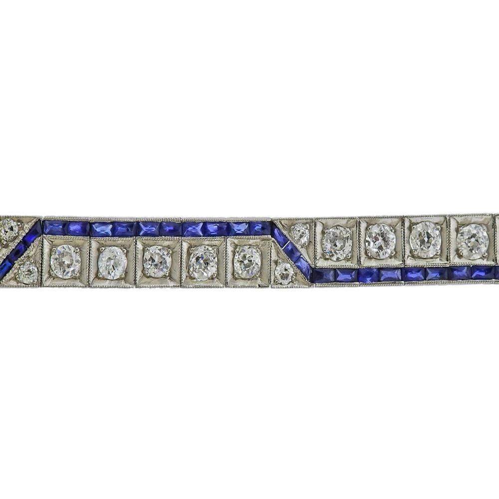 Art Deco 1920s platinum line bracelet, set with blue sapphires and approx. 3.50ctw in old mine cut diamonds. Bracelet is 6.75