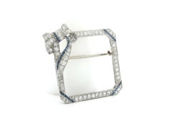 Art Deco Platinum Diamond & Sapphire Open Square Cut Corner Ribbon Top Brooch