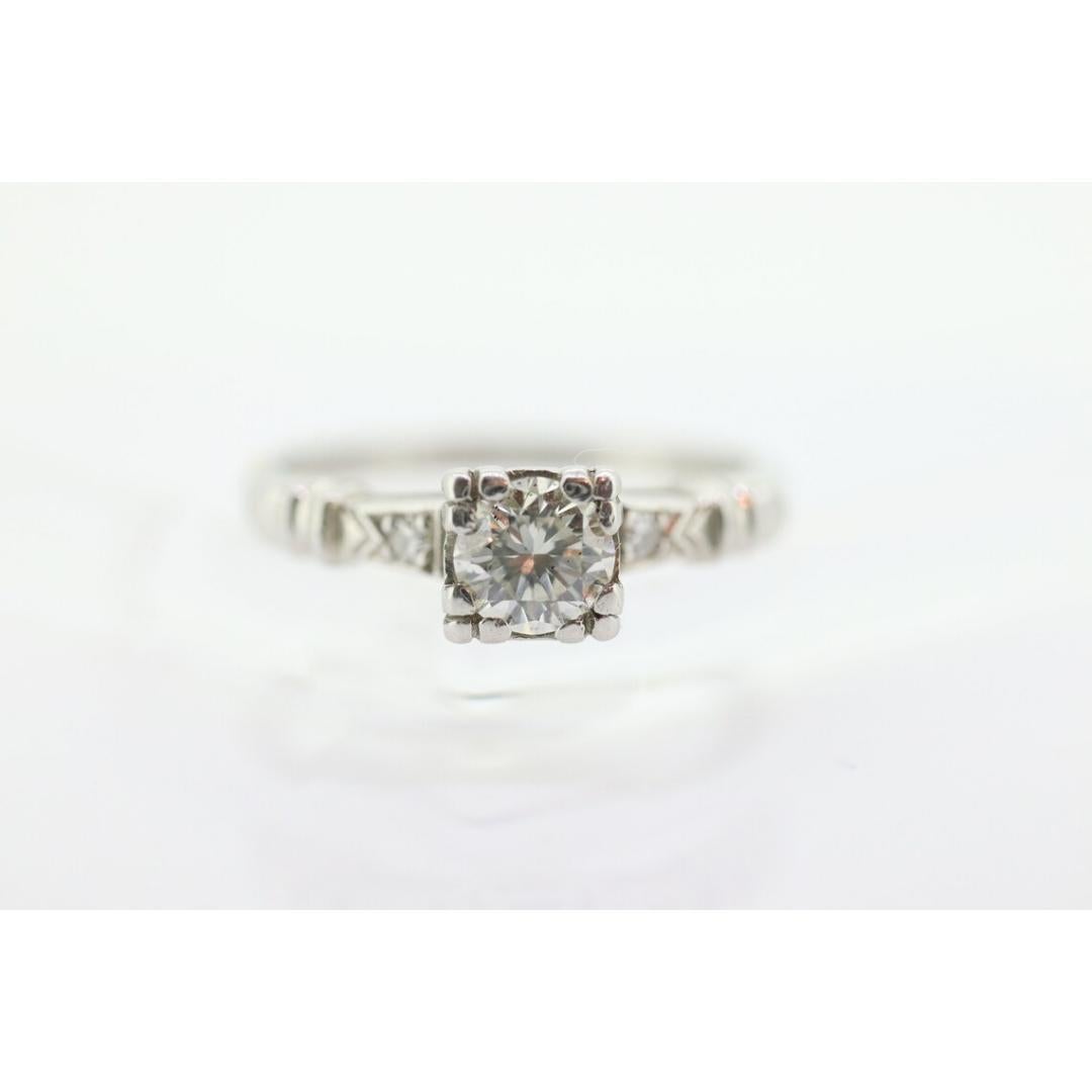Vintage from the 1930s
Size: 6 US
Materials: Stone
Gemstone: Diamond
Gem color: Colorless
Band color: Gold

Style: Art deco

Amazing Art Deco Solitaire ring. Diamond set in a square table. Platinum and Iridium.

Appraised at $1950 Replacement value.