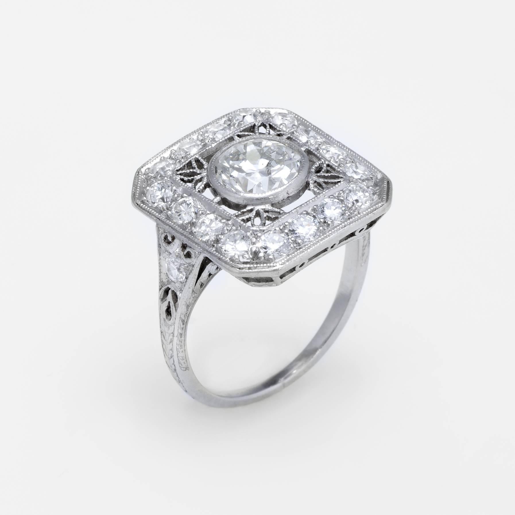 Finely detailed vintage Art Deco era ring (circa 1920s to 1930s), crafted in 900 platinum. 

Centrally mounted estimated 0.75 carat old European cut diamond is accented with 18 x 0.04 carat (estimated) old European cut diamonds. 
The total diamond