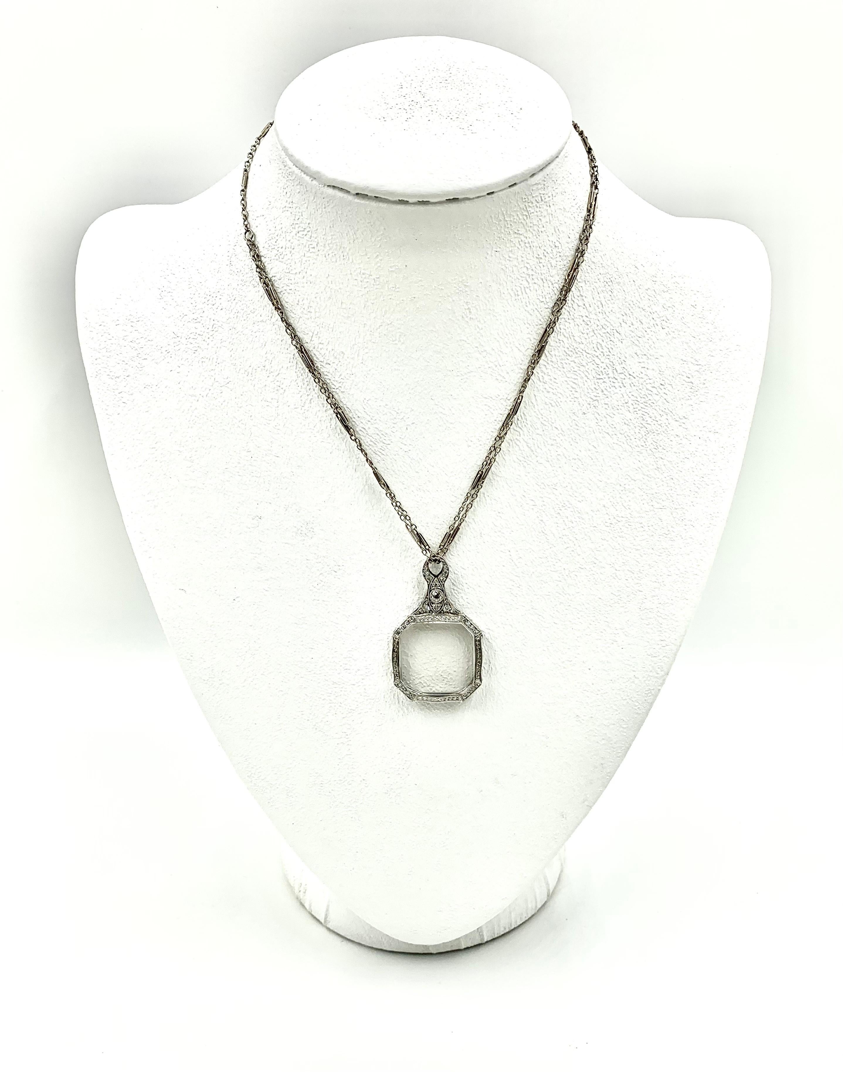 This fabulous transformative jewel wears beautifully as a large diamond set pendant and transforms to a stylish lorgnette with a push of a button. Featuring 30 Old Mine diamonds, with the largest diamond set in an unusual inverted eye design. On a
