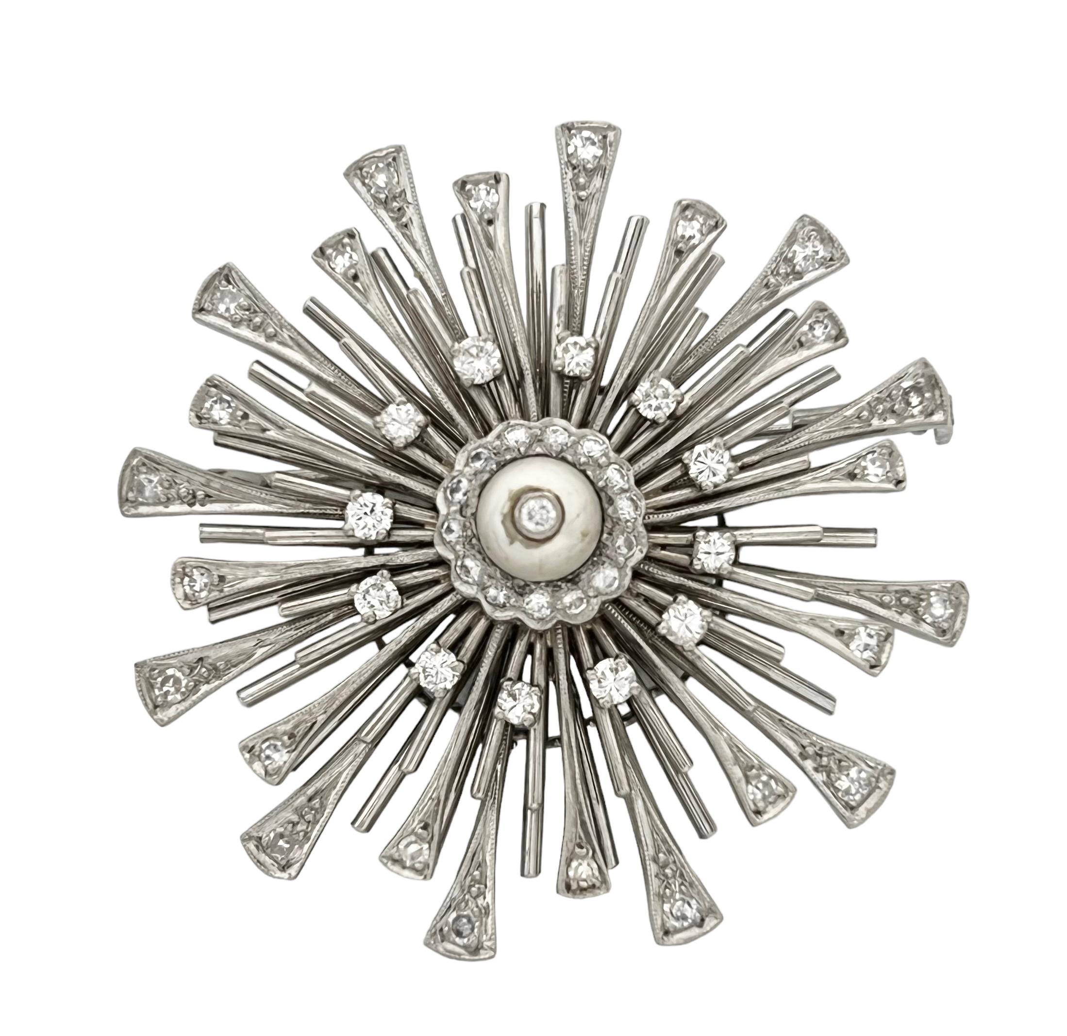 Art Deco Platinum Diamonds and Natural Pearl Pendant / Brooch
This Art deco platinum diamonds and natural unique sunny design pendant / brooch is set with old cut natural white diamonds including 1 diamond that is set in a central natural white