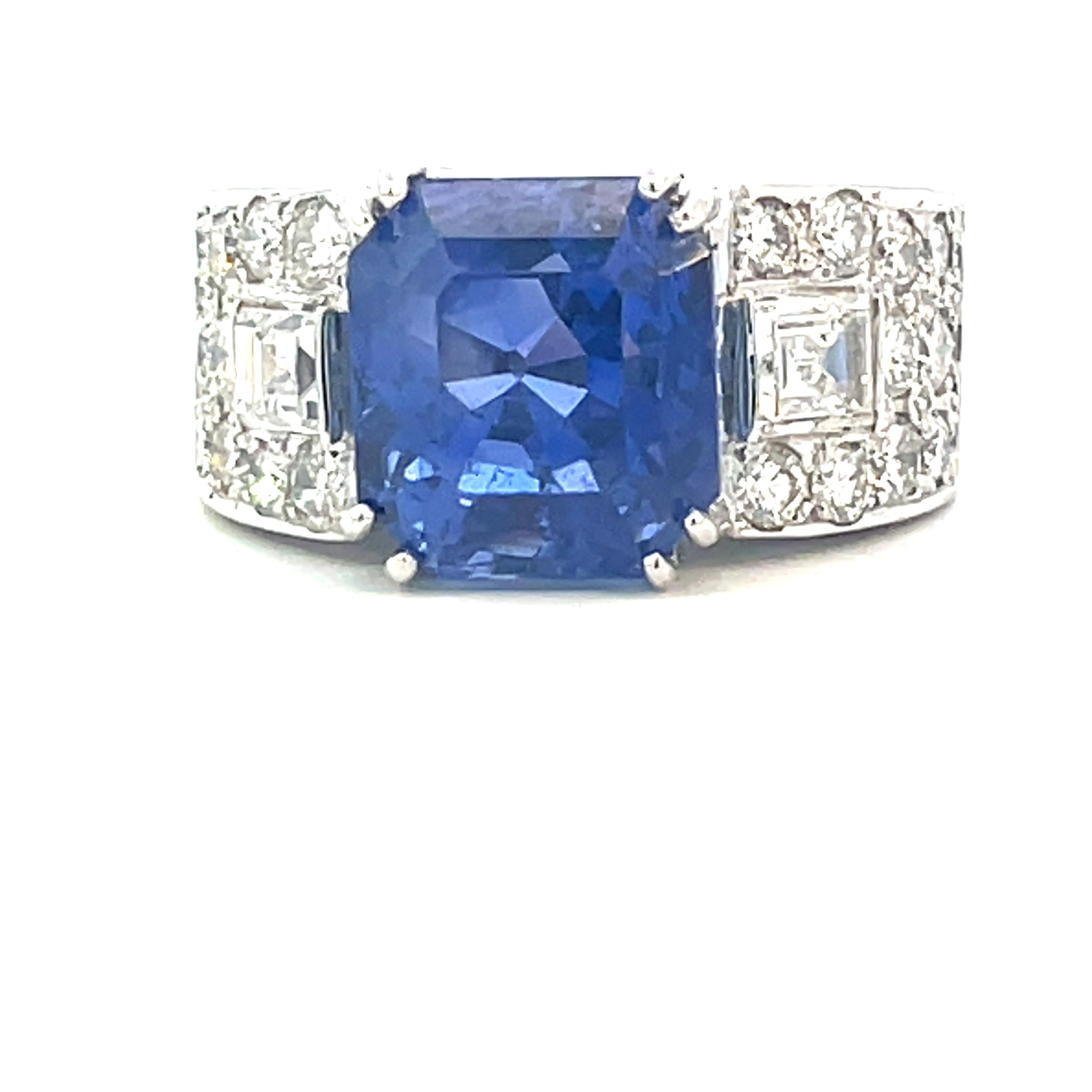Exquisite Sapphire and Diamond Platinum Ring

Introducing a breathtaking masterpiece featuring a stunning 7.36-carat central blue sapphire of remarkable vivid blue tone. This captivating gem, originating from Ceylon, boasts a rare quality,