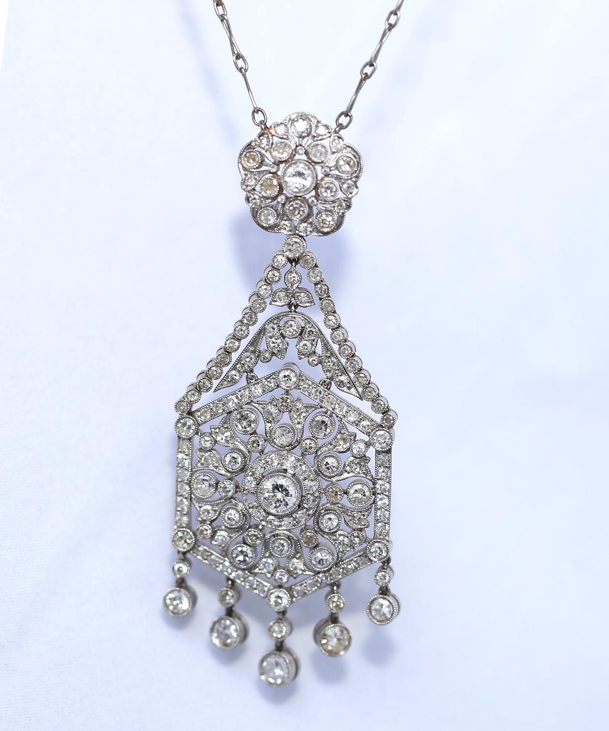 Art Deco Platinum Diamonds Pendant and a Chain. Created in 1920 es.
A truly superb quality Platinum pendant and a chain. Late Art Deco style with extensive use of Diamonds. The pendant has two parts linked together and five Diamonds each separately