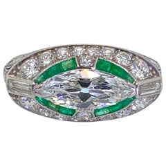 Vintage Art Deco Platinum East West Marquise Cut Diamond and Emerald Ring