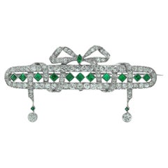 Art Deco Platinum Emerald and Diamond Bow Brooch with Diamond Drops