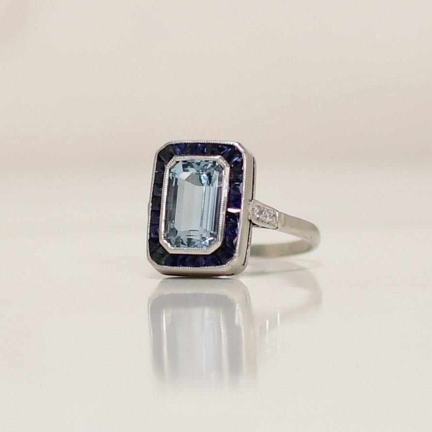 Art Deco Platinum Emerald Cut Aqua With Sapphire Halo Ring In Good Condition For Sale In Addison, TX