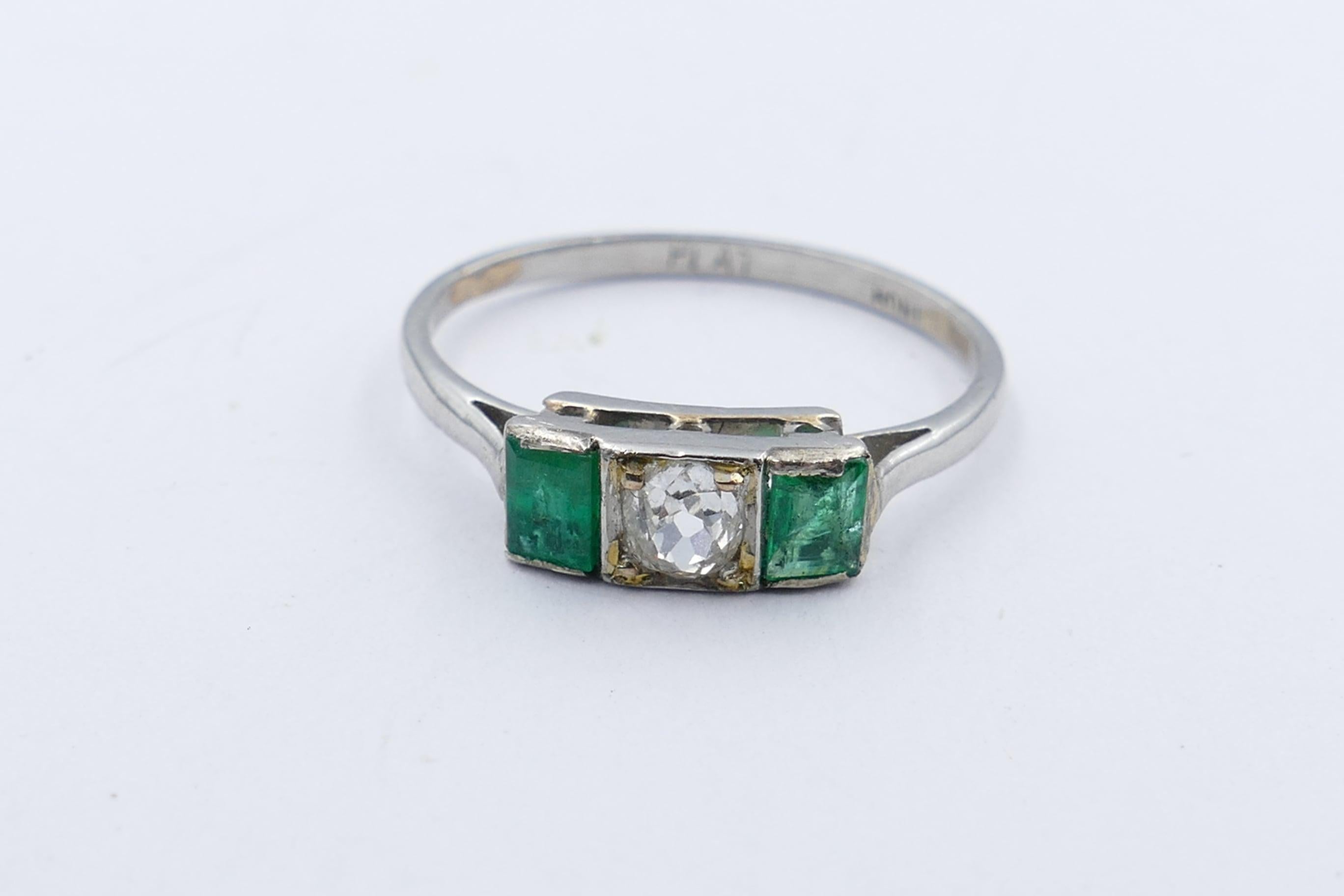 This much sought after Deco Period, Emerald & Diamond Band Ring, features 1 X 0.15 carat Diamond ( although it does look considerably larger), colour H, clarity SI-1, rose cut, & 4 claw set. It is flanked by 2 bluish-green Emeralds, rectangular step