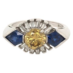 Antique Art Deco Platinum, Fancy Colored Diamond, Diamond and Sapphire Ring