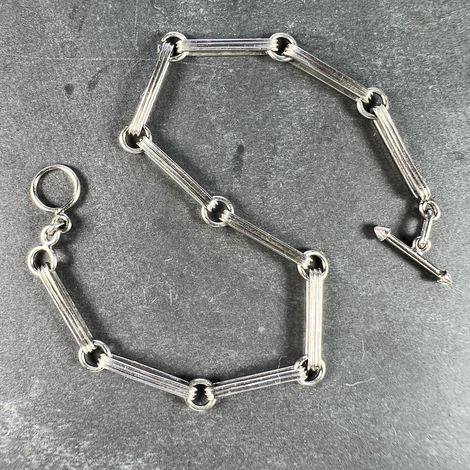 Ein Art-Deco-Armband aus Platin mit einer Kette aus länglichen Gliedern, die durch kreisförmige Ringe verbunden sind. Das Armband ist unmarkiert, wurde aber als 950er Platin getestet. 7
