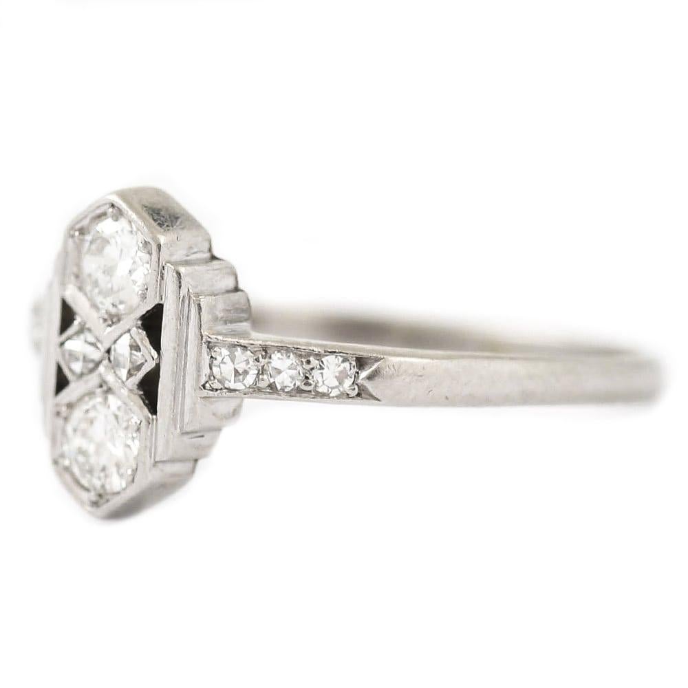 A fantastic original Art Deco platinum four stone diamond ring in platinum. An iconic design with strong geometric form so redolent of the Art Deco period. Manufactured by one of Englands most outstanding jewellery companies Alabaster and Wilson in