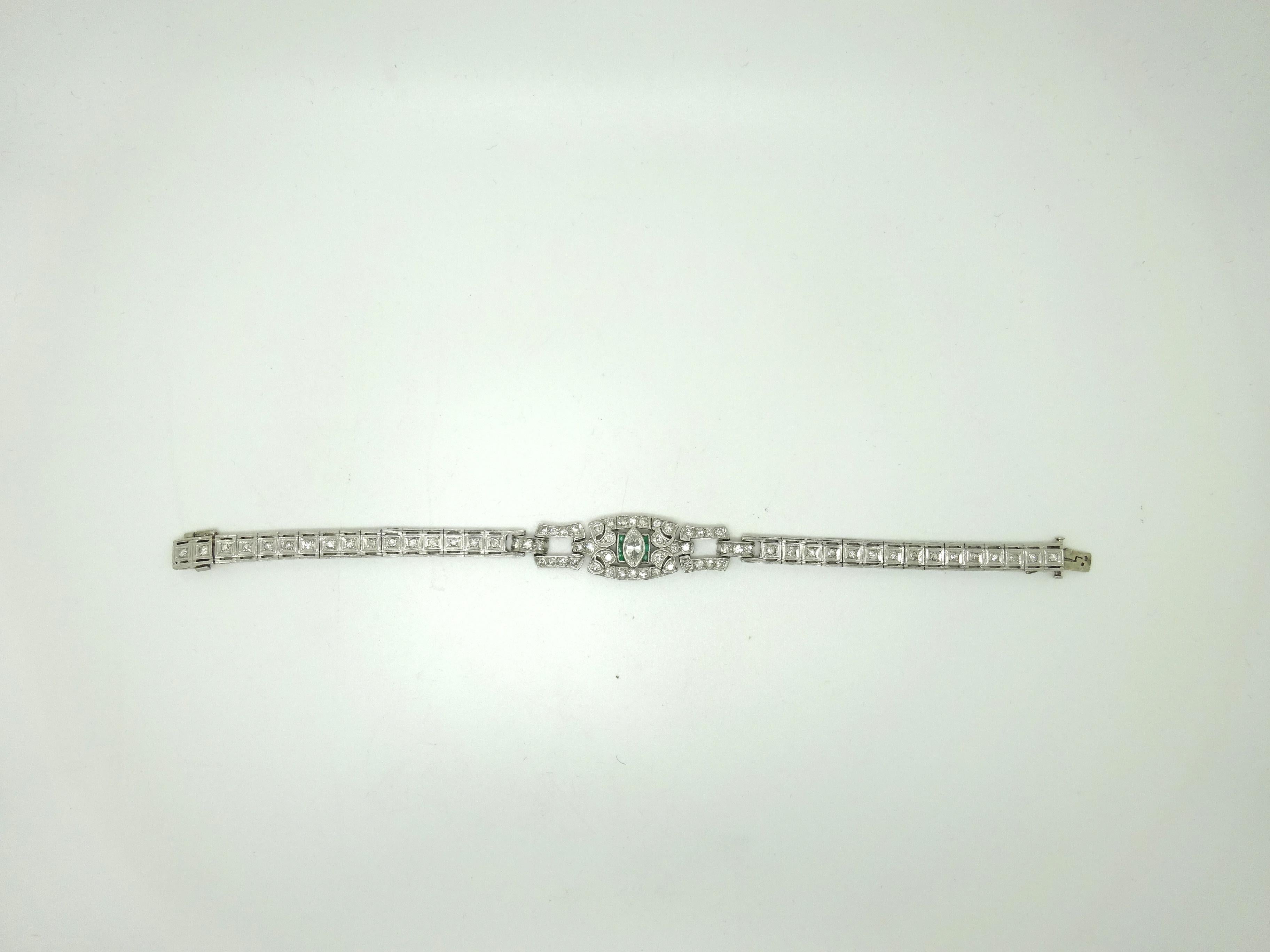 Art Deco Platinum Genuine Natural Diamond Bracelet with Emeralds (#J3489)

Platinum Art Deco bracelet featuring dazzling diamonds and emeralds.The center diamond is in a marquise shape, and it's approximately .50 carats. The round side diamonds have