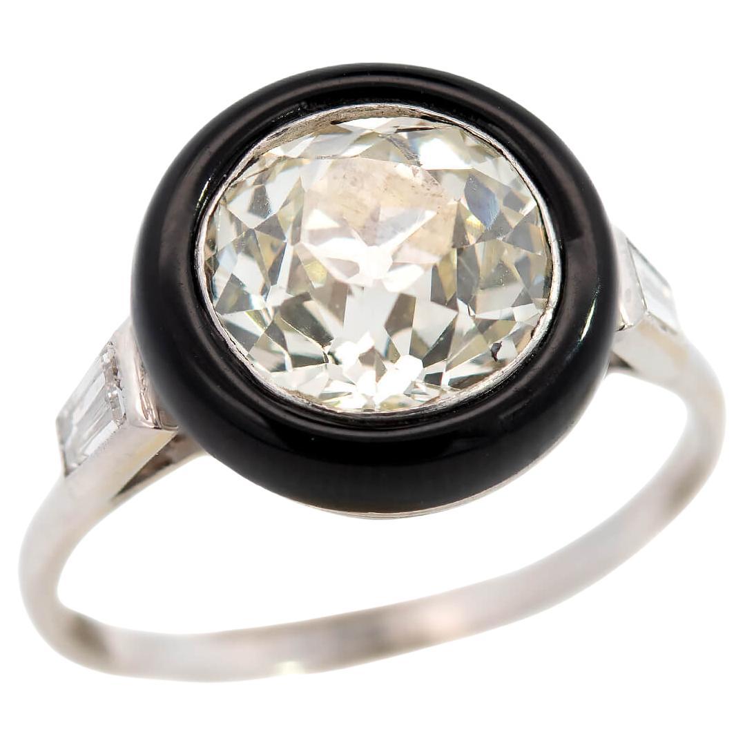 Art Deco Platinum Halo Onyx and Diamond Ring For Sale