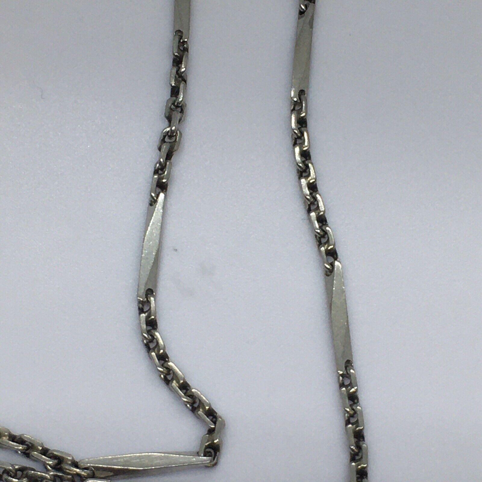 Art Deco Platinum Handmade Necklace Chain possibly Japan 1920s 

Length 21 Inch
Measurements  Longer links 13mm  by 2mm thick, Smaller 3 mm round 
Metal Platinum, tested at 90% 
Weight 18.8 Gram 
Condition Gently used, No sign of repairs, see