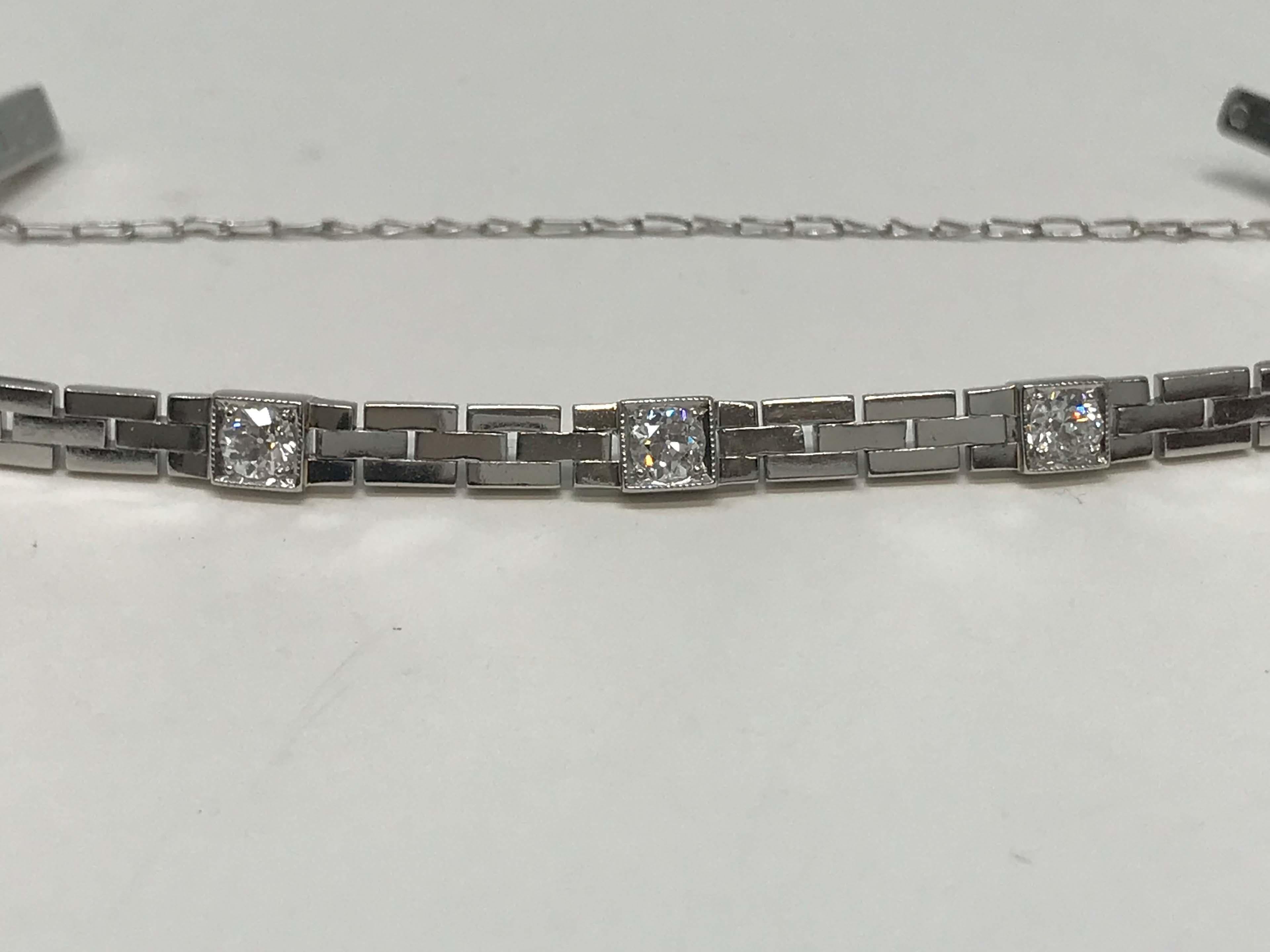 Art deco platinum bracelet with three genuine diamonds weighing .15ct each for a total of .45ct, clarity VS, color H, not stamped but acid tested. Measures 6 1/4 inches long. The bracelet has a monogram MLC and a security chain. Made in Canada,