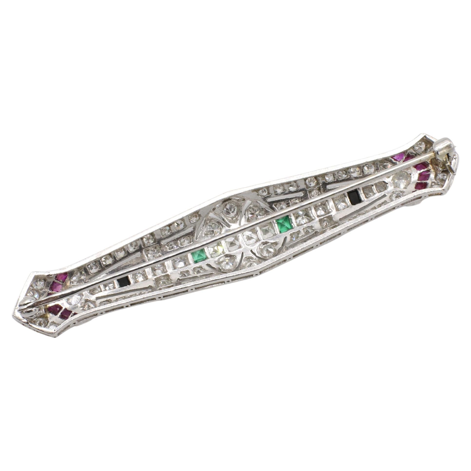 Art déco Broche Art Déco en platine avec diamant naturel, émeraude, rubis et onyx en vente