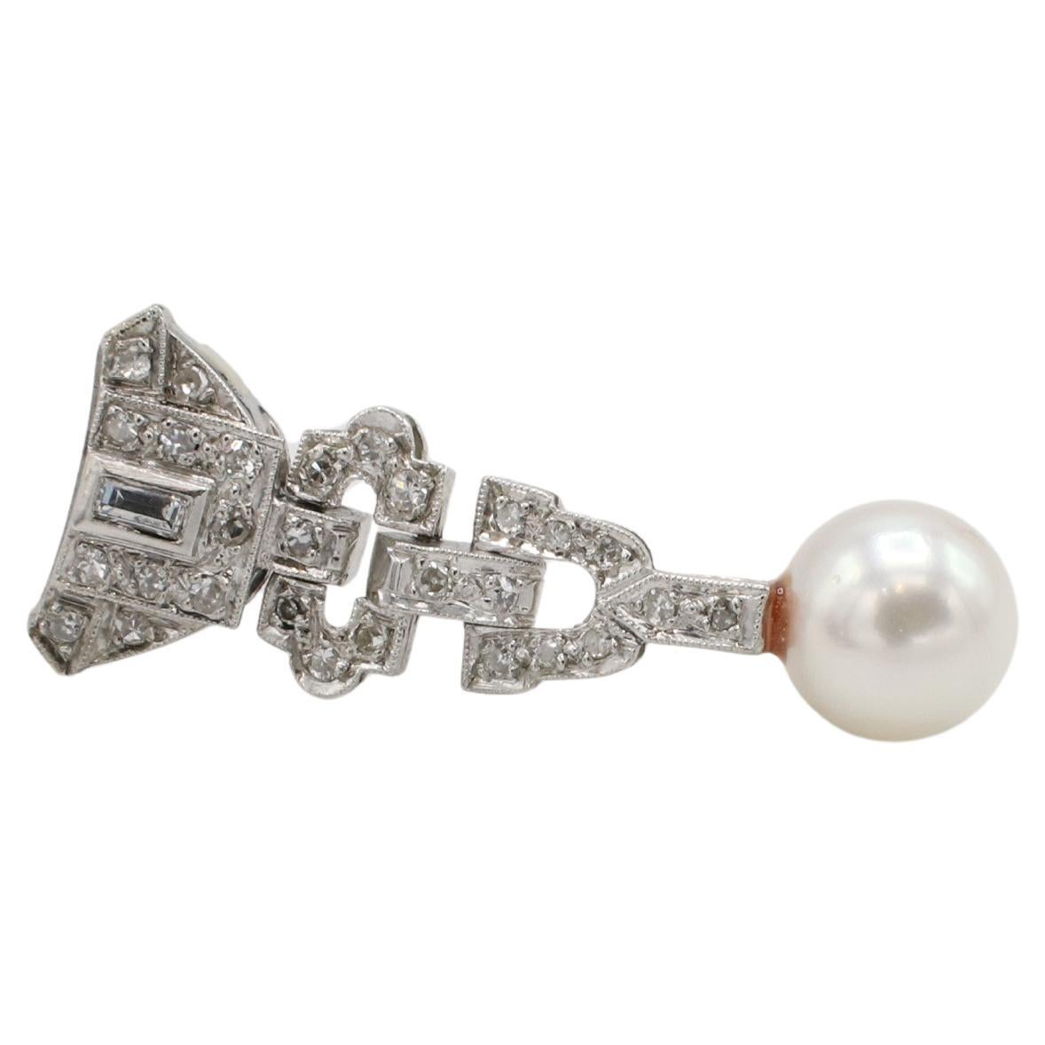 Art Deco Platinum Natural Diamond & Pearl Dangle Drop Earrings 
Metal: Platinum
Weight: 8.12 grams
Diamonds: Approx. .60 CTW natural single cut and baguette diamonds H-I SI
Length: 1.25 inches
Pearl: Cultured, 7.8mm
Backs: Push backs
