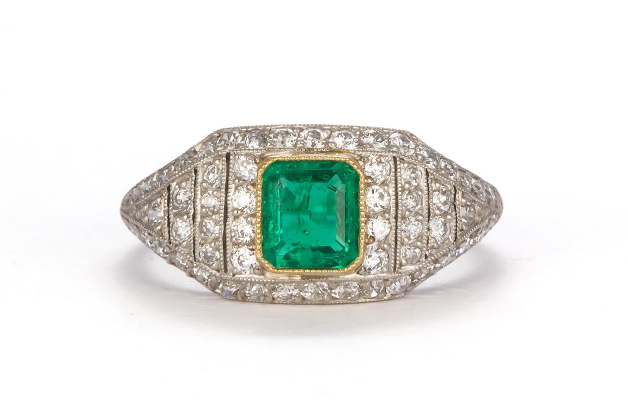 We are pleased to offer this Art Deco Platinum Natural Emerald & Diamond Ring. This stunning ring feature a 1.35ct natural emerald accented by approximately 0.55ctw round brilliant cut diamonds all set in a vintage art deco platinum ring. The ring