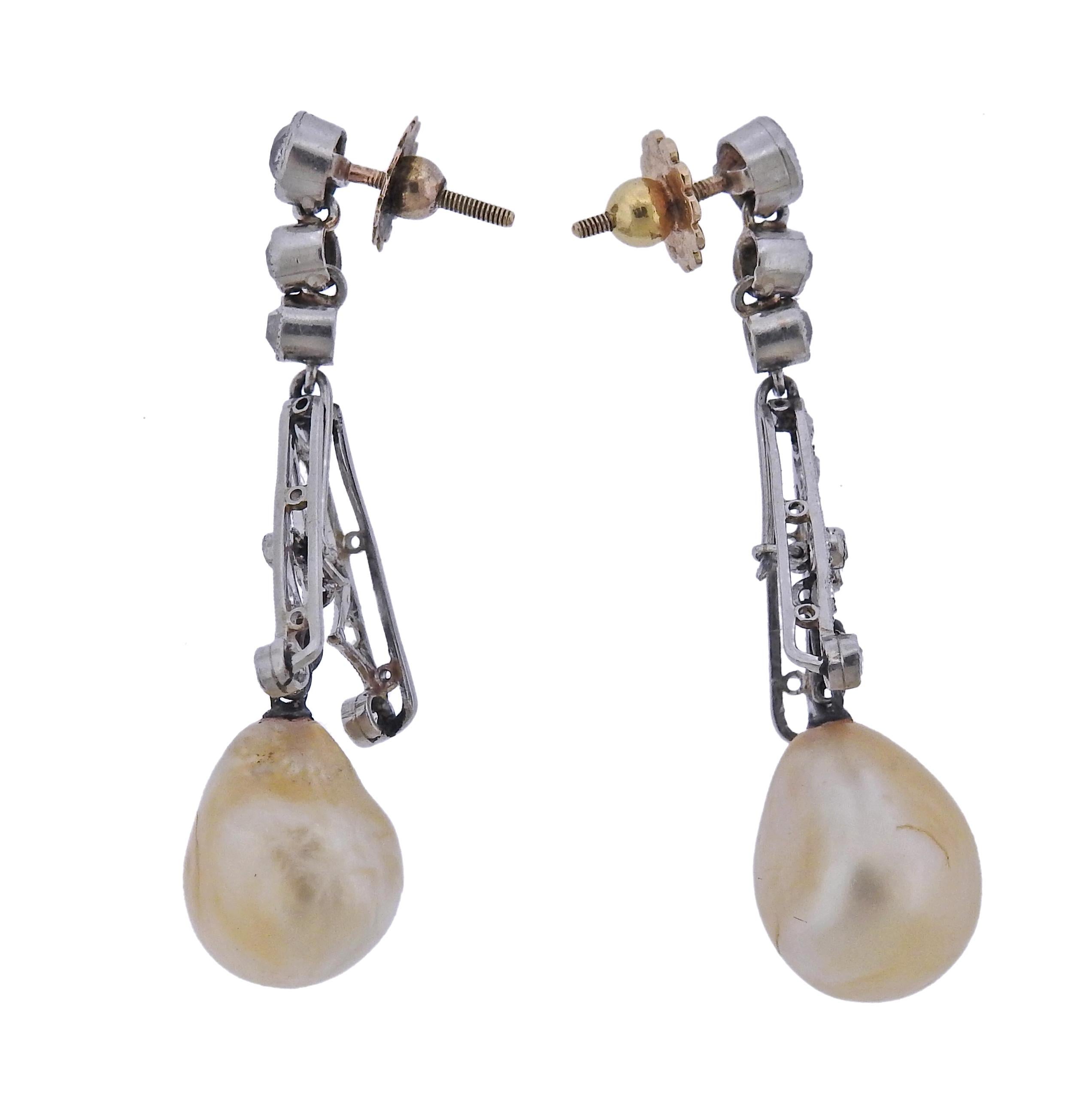 Art Deco platinum and gold posts/back earrings, with two natural pearls, measuring approx. 12.6 x 10mm and 13.3 x 10.9mm. Surrounded with rose and old mine cut diamonds. Earrings are 44mm long. Weight - 8.7 grams.
