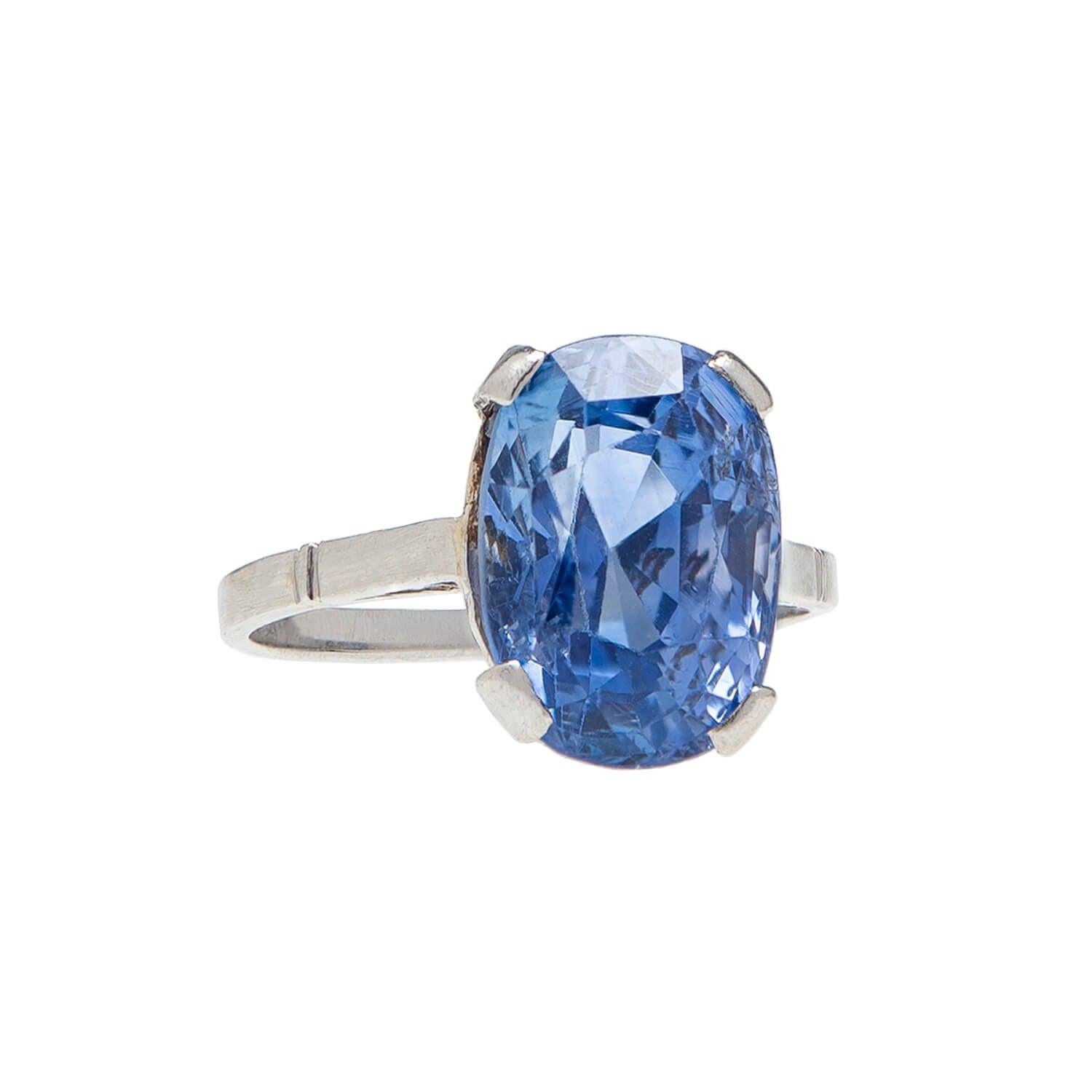 An exquisite sapphire ring from the Art Deco (ca1930) era! This stunning piece is crafted in platinum and holds an incredible natural sapphire at the center of a classically simple prong setting. The four prong set Ceylon (Sri Lankan) sapphire has