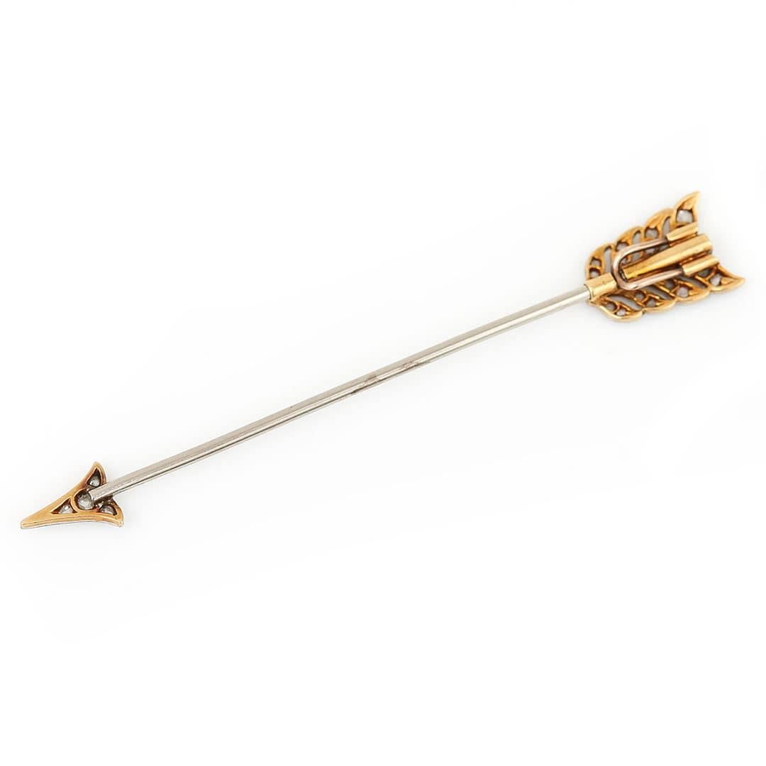 A timeless Art Deco platinum and 18ct gold jabot brooch pin set with old cut diamonds and dates from circa 1920. Made during the height of their popularity the Art Deco jabot pin was a functional piece of jewellery and used to secure ruffled or lace