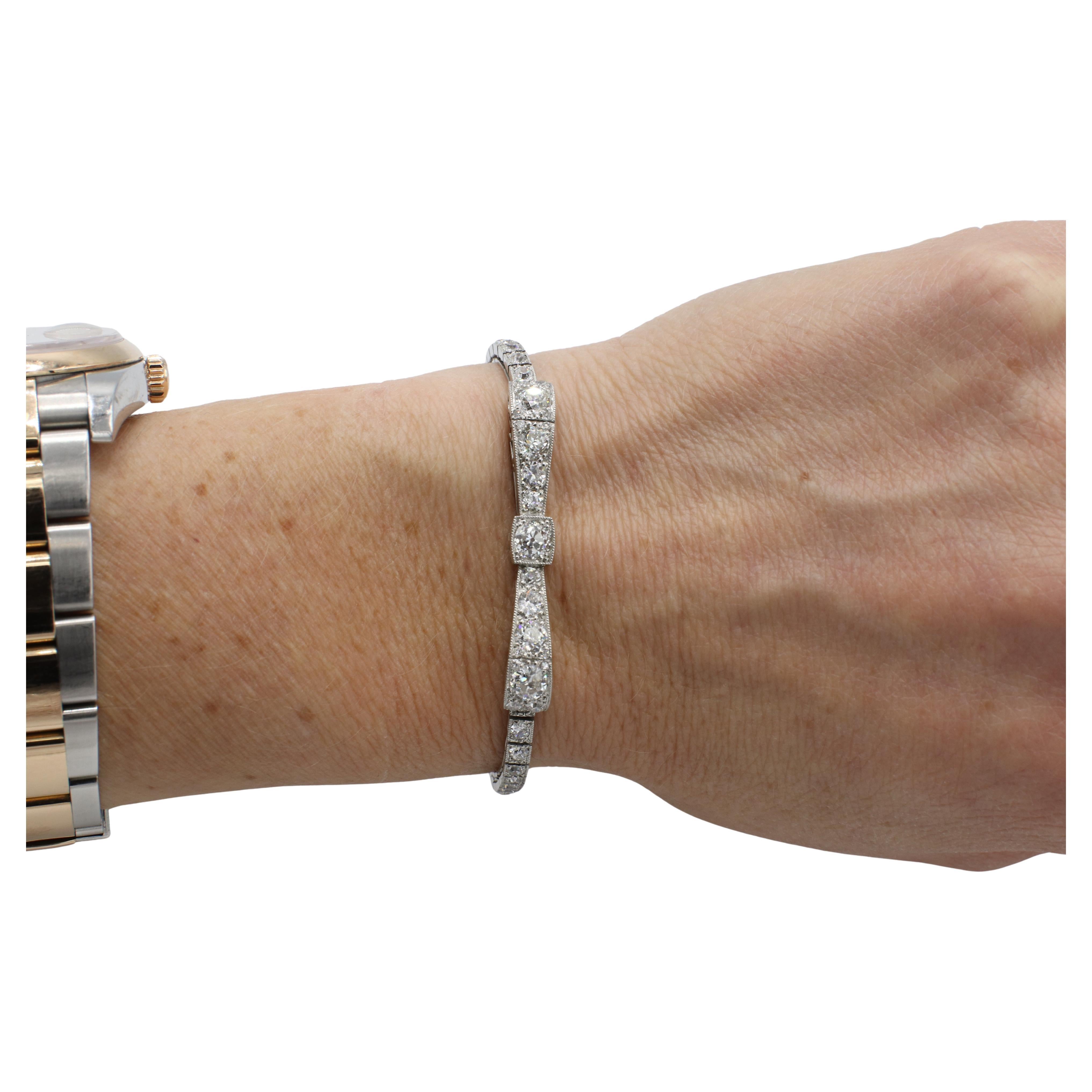 Art Deco Platinum Old European Cut 3.50 Carat Natural Diamond Ribbon Bow Bracelet 
Metal: Platinum
Weight: 14.88 grams
Diamonds: Approx. 3.50 CTW old European cut natural diamonds G-H VS
Length:  6.15 inches
Width: 3 - 5.5mm
