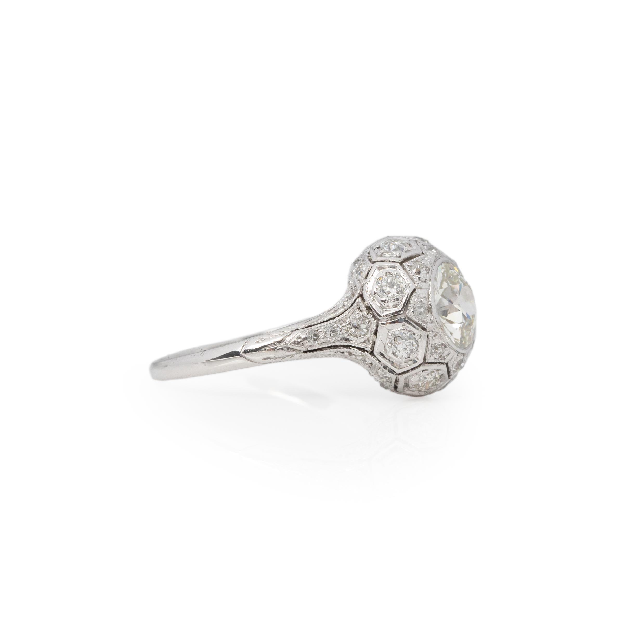 Perfect for any vintage jewelry lover in your life. This platinum Art Deco ring has outstanding details and thoughtful design. Atop the tapered shanks is a elegant dome shape, giving all the disco ball vibes with the encrusted diamonds. Making up