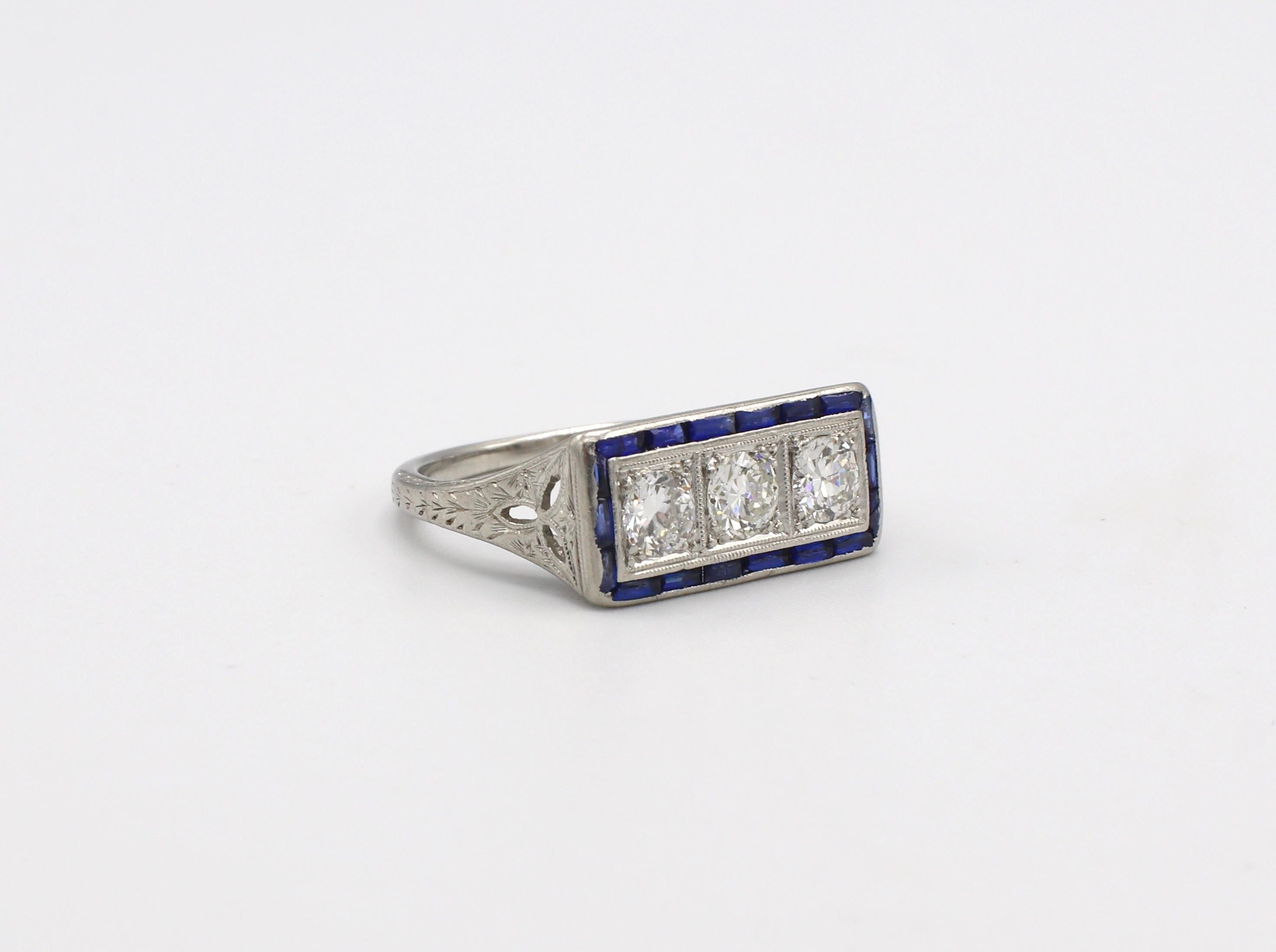 Art Deco Platinum Old European Cut Diamond & Sapphire 3 Stone Ring Size 5.75 

Metal: Platinum
Weight: 4.49 grams
Diamonds: 3 Old European cut diamonds, approx. .60 CTW G VS
Sapphires: Approx. .40 CTW slightly abraded facet junctions with age
Size: