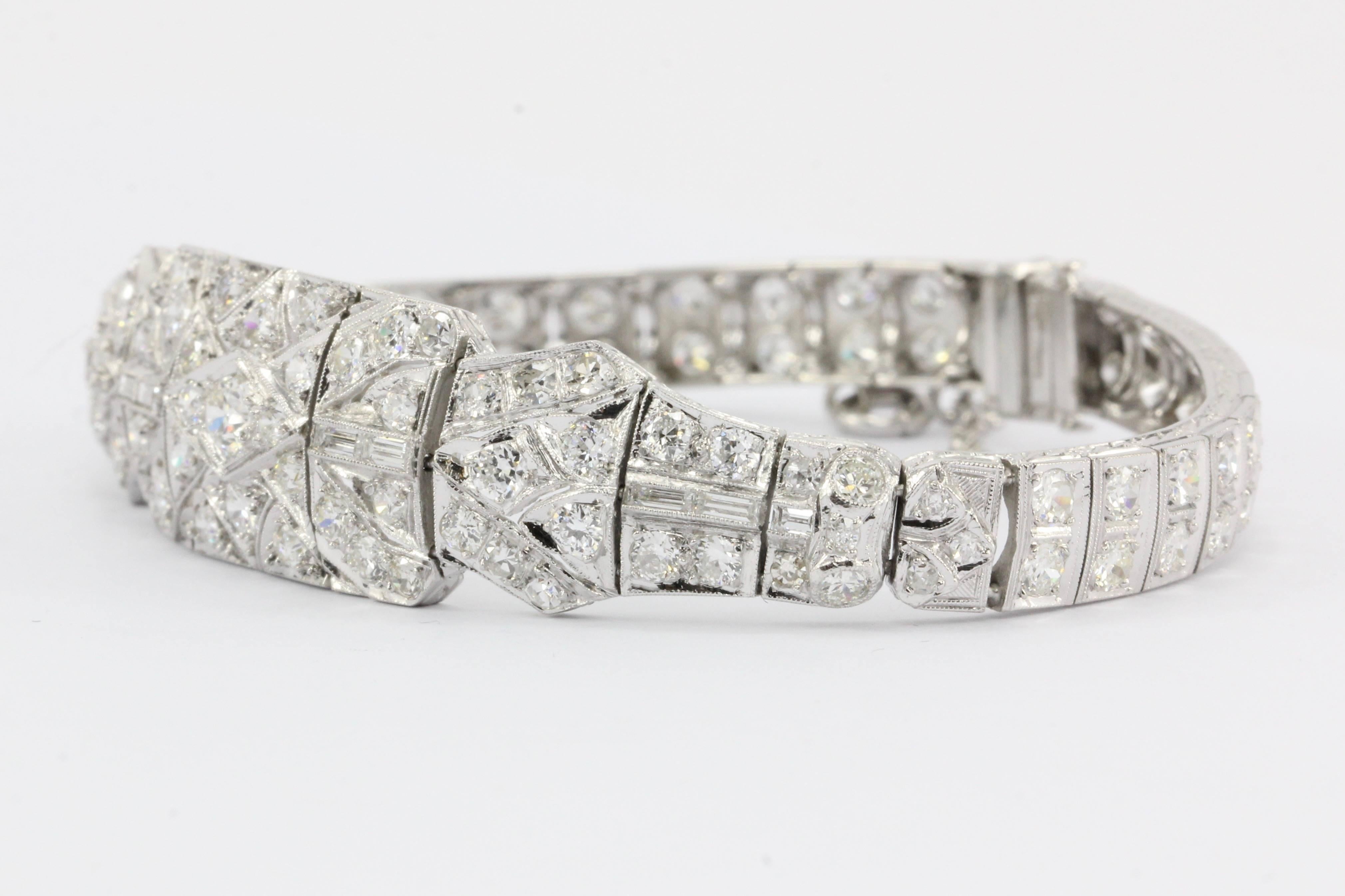 Era: Art Deco c.1920's

Composition: Platinum

Primary Stone: Old European Cut Diamonds

Stone Carat: Approximately 5 carats total

Color / Clarity: H/I - Vs1/Si1

Bracelet length: 7