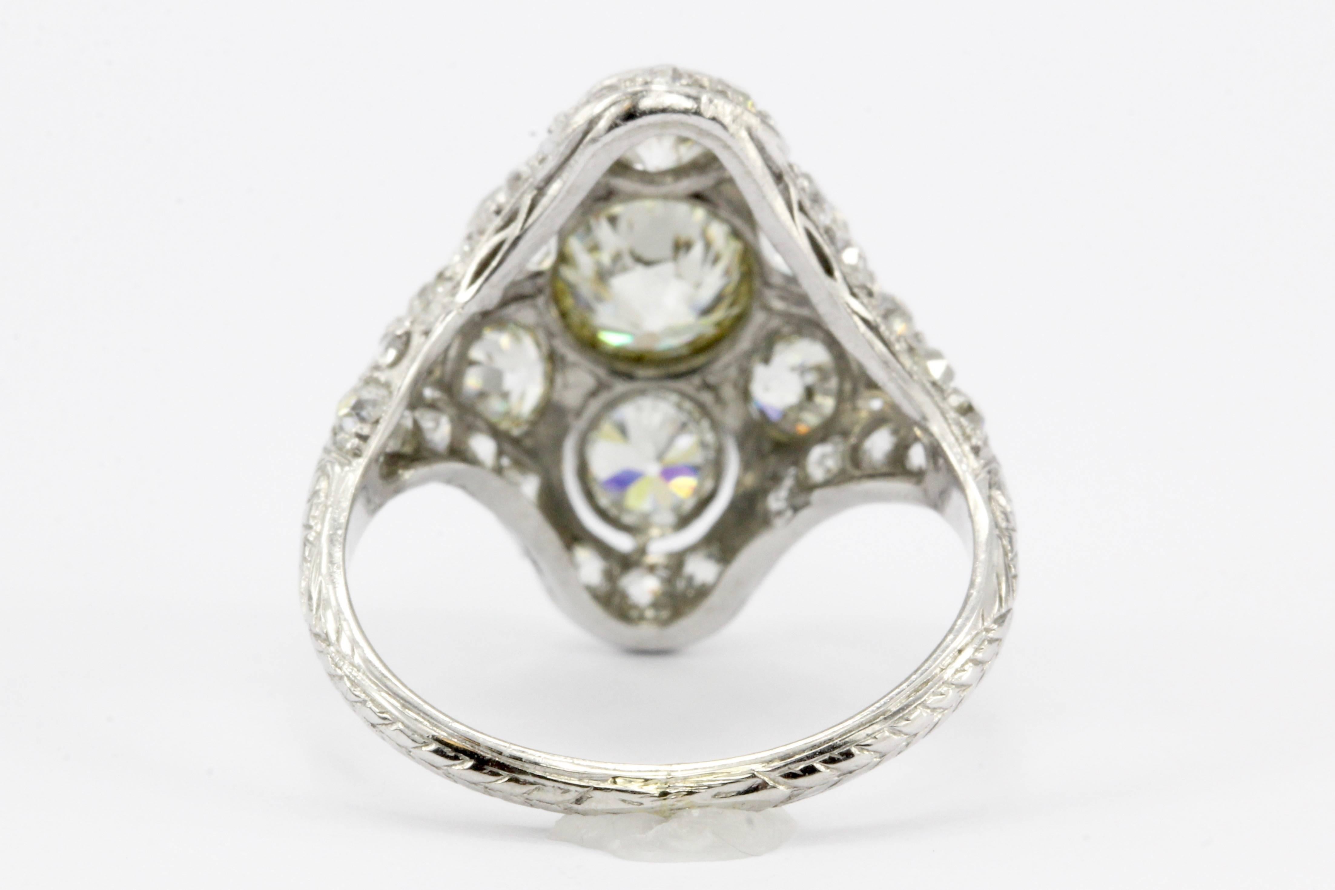 Women's Art Deco Platinum Old European Cut Diamond Three-Stone Cluster Ring, circa 1920s