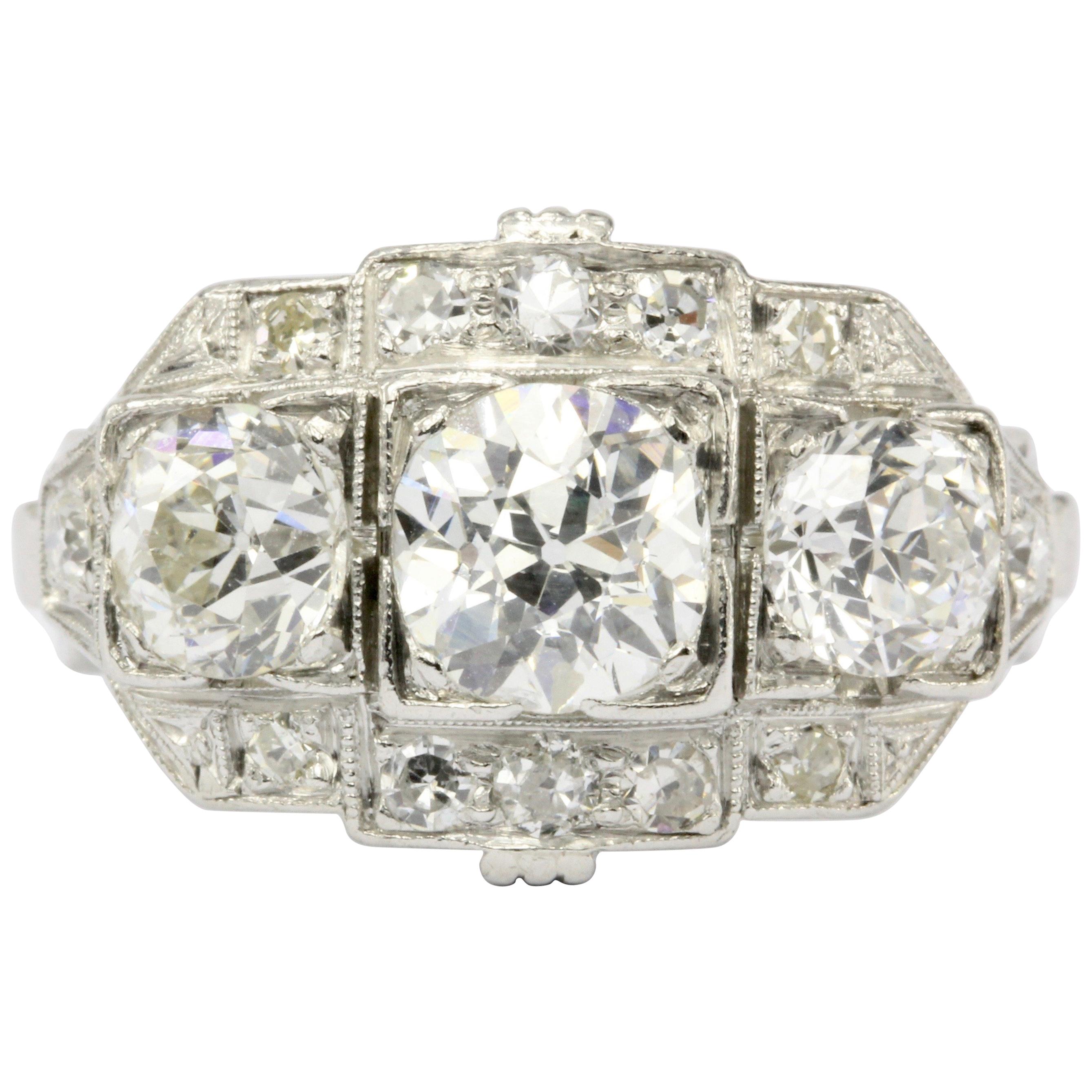 Art Deco Platinum Old European Cut Diamond Three-Stone Cluster Ring, circa 1920s