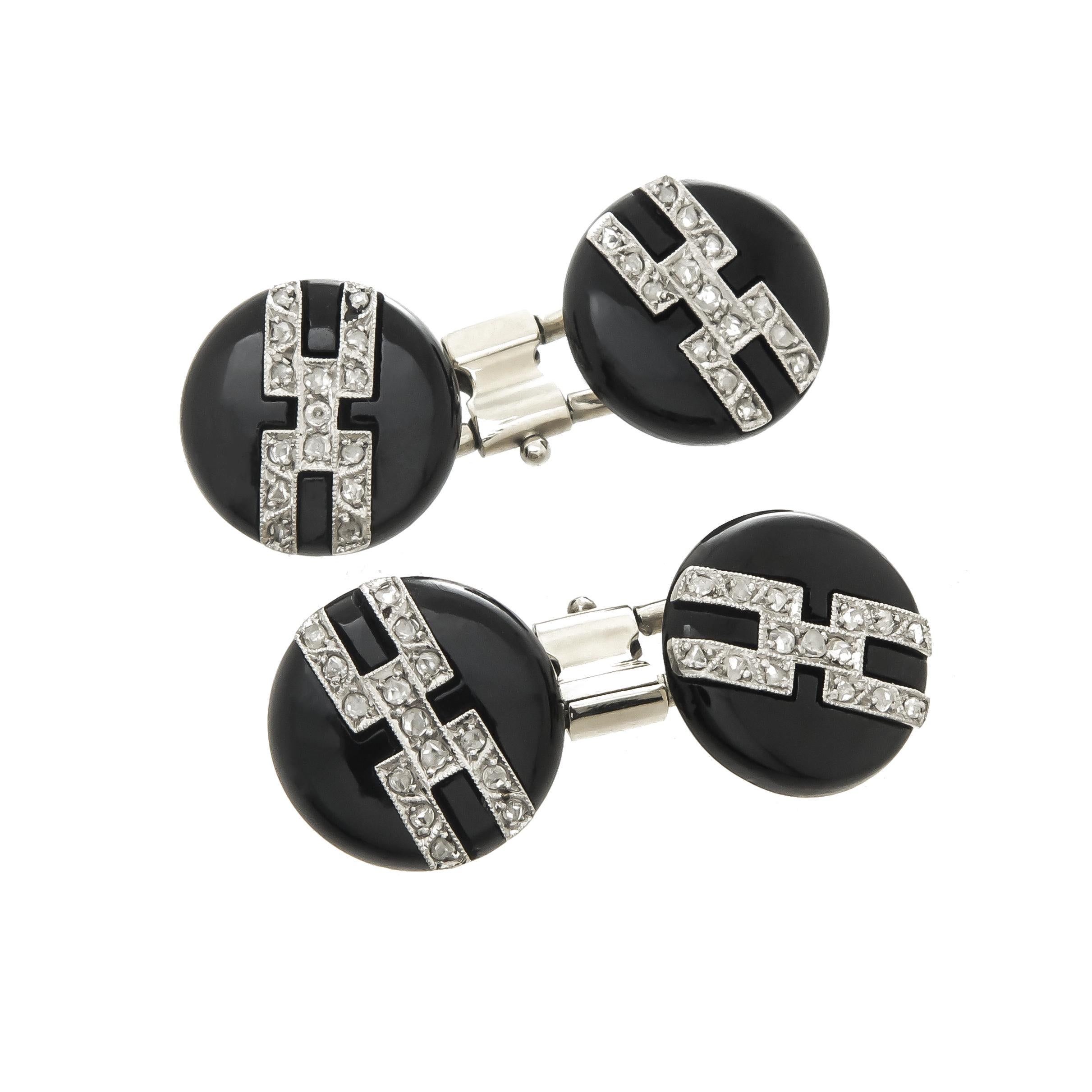 Circa 1930 Tuxedo dress set, comprising of Cufflinks, Shirt studs and 2 vest studs, Platinum tops on Onyx, set with Rose cut Diamonds, White gold backs, the Cufflinks and Shirt studs measure 1/2 inch in diameter. original fitted leather box with