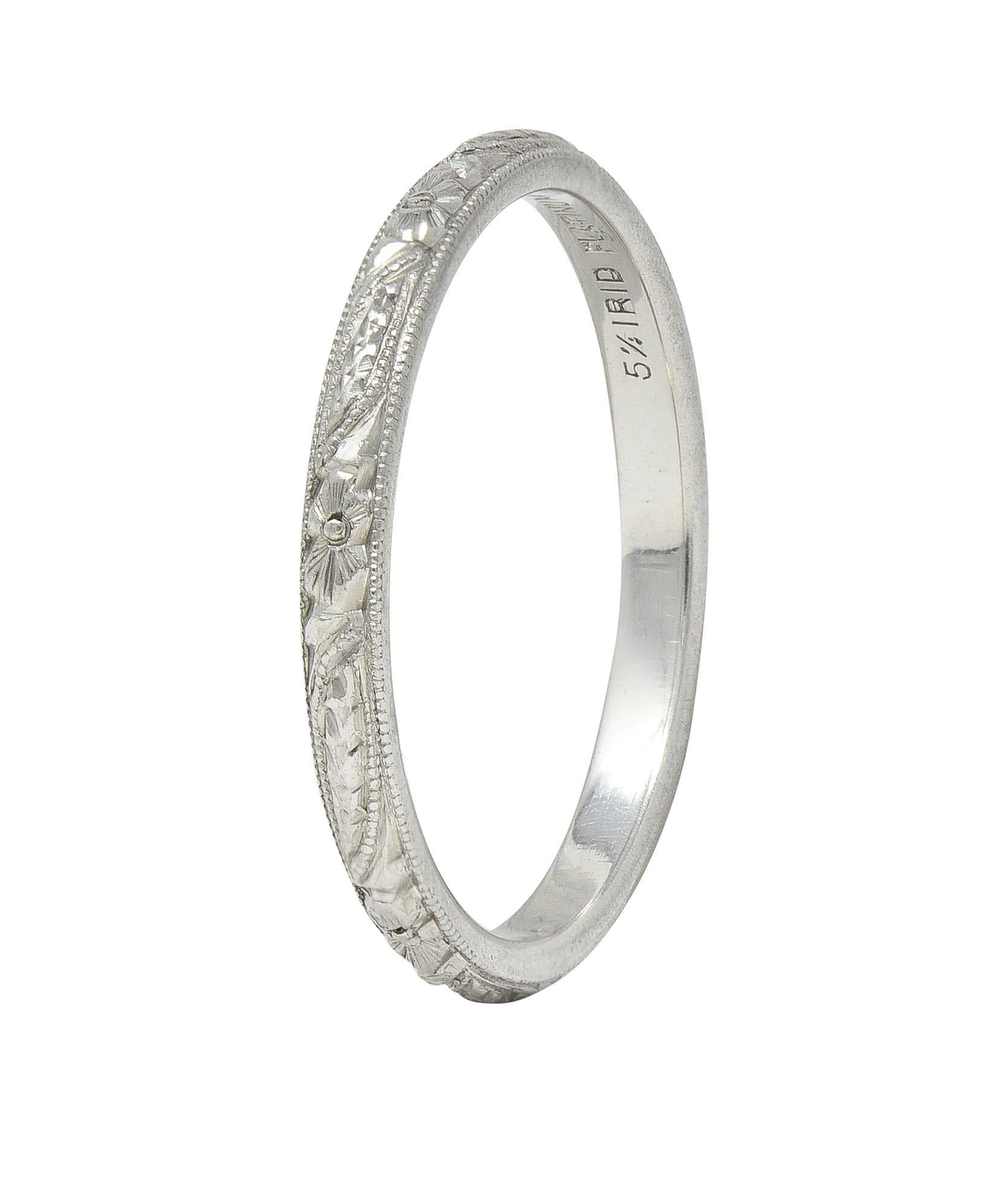 Band ring features a raised orange blossom and wheat motif fully around
With milgrain detail edges
Stamped for platinum
Circa: 1930s
Ring size: 4 3/4 and not sizable
Measures North to South 2.0 mm and sits 1.5 mm high
Total weight: 2.3 grams
Stock