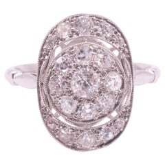 Bague Art déco en platine avec diamant ovale et couronne ajourée
