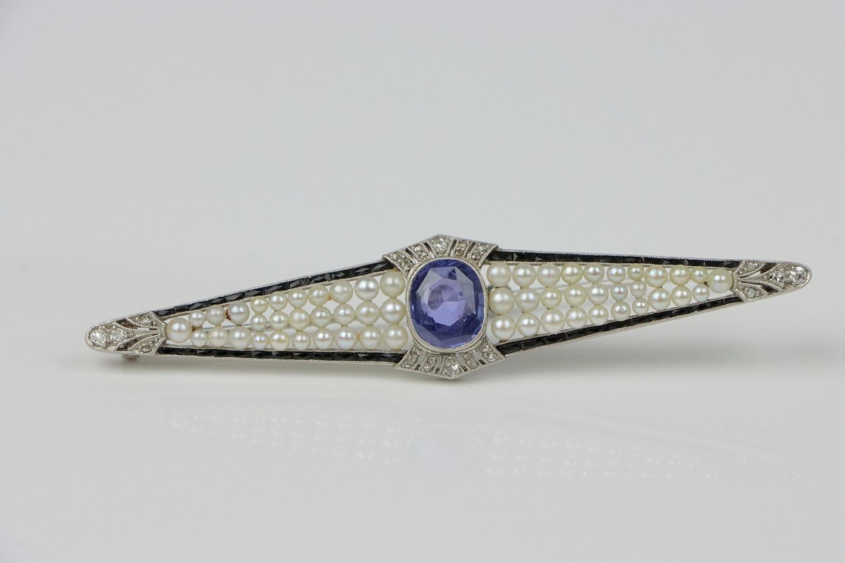 Art Deco Platinum Pearl & Ceylon Unheated Sapphire Brooch Pin  
AGL Certified 

Accompanied by AGL Report 1116818 - August 30th, 2021
The report states that the Oval Blue Sapphire is of Ceylon (Sri Lanka) Natural Color - Unheated Origin.
The