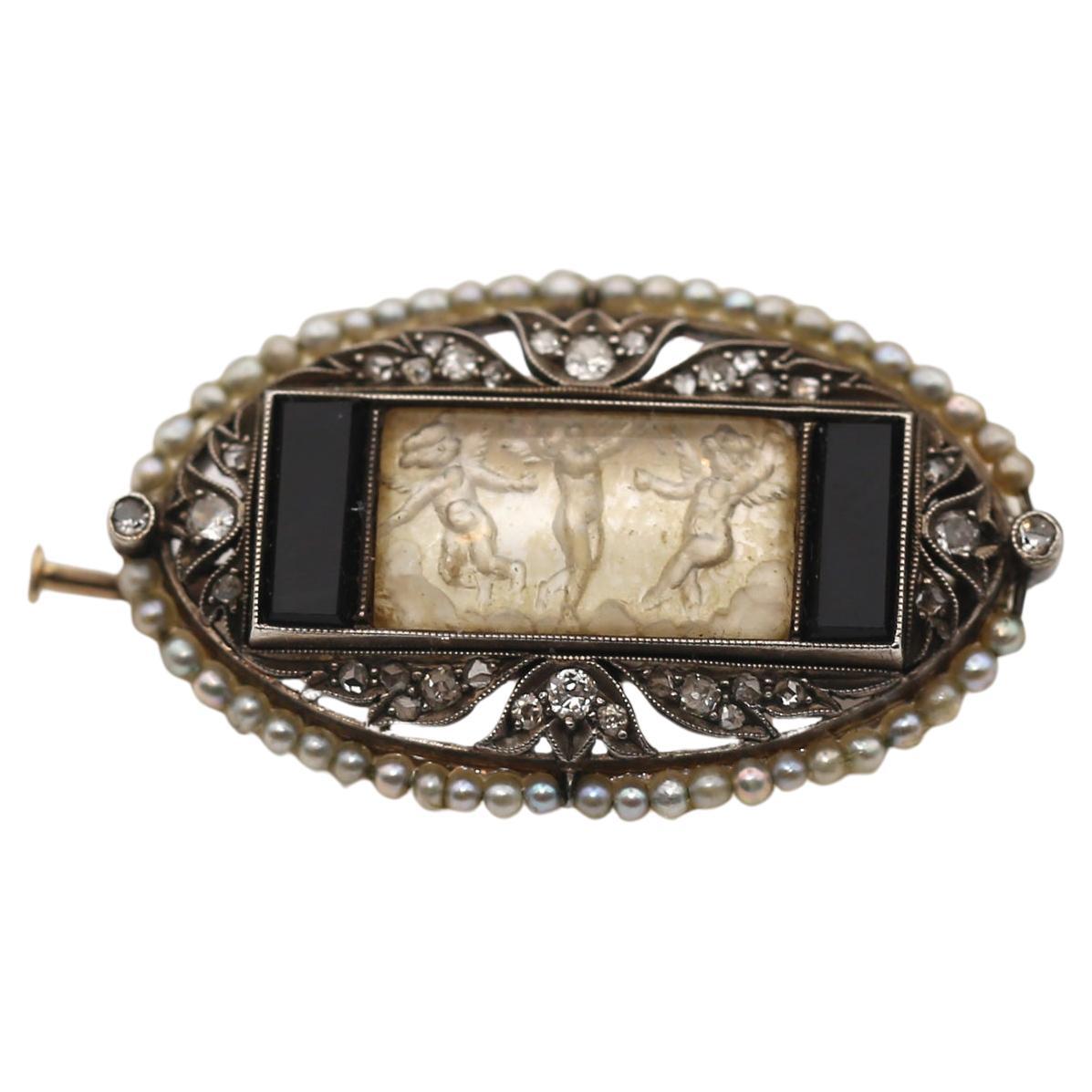 A truly fine item. Comprising an openwork rectangular with Rock Crystal plaque finely carved with figures of a lady surrounded by two putti figures. Creating the fully 3D effect of the past, a mother-of-pearl layer was added. The effect is almost