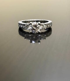 Art Deco Platinum Round D Color 0.73 Carat Three Stone Diamond Engagement Ring