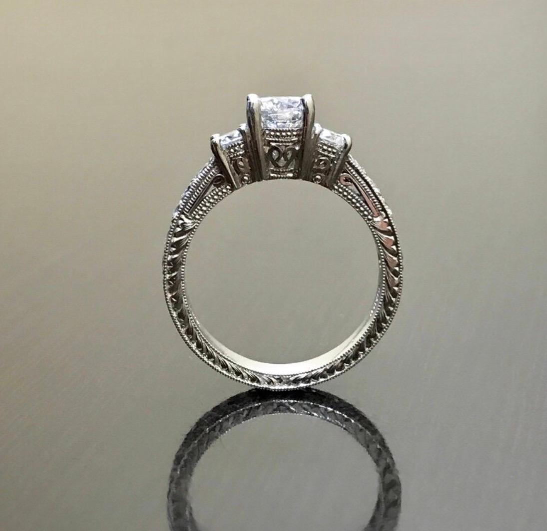 Art Deco Platinum Round D Color 0.73 Carat Three Stone Diamond Engagement Ring In New Condition For Sale In Los Angeles, CA