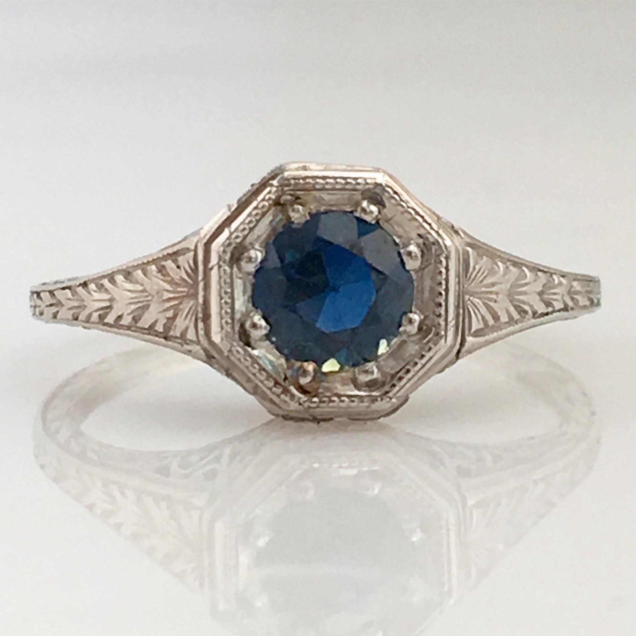 Details:
Stunning Art Deco Period platinum and sapphire ring—would make a lovely wedding ring! The center stone is estimated .40 carats, and measures 4.9mm round. The filigree is beautiful on this ring, and is in lovely shape. This is a stunning