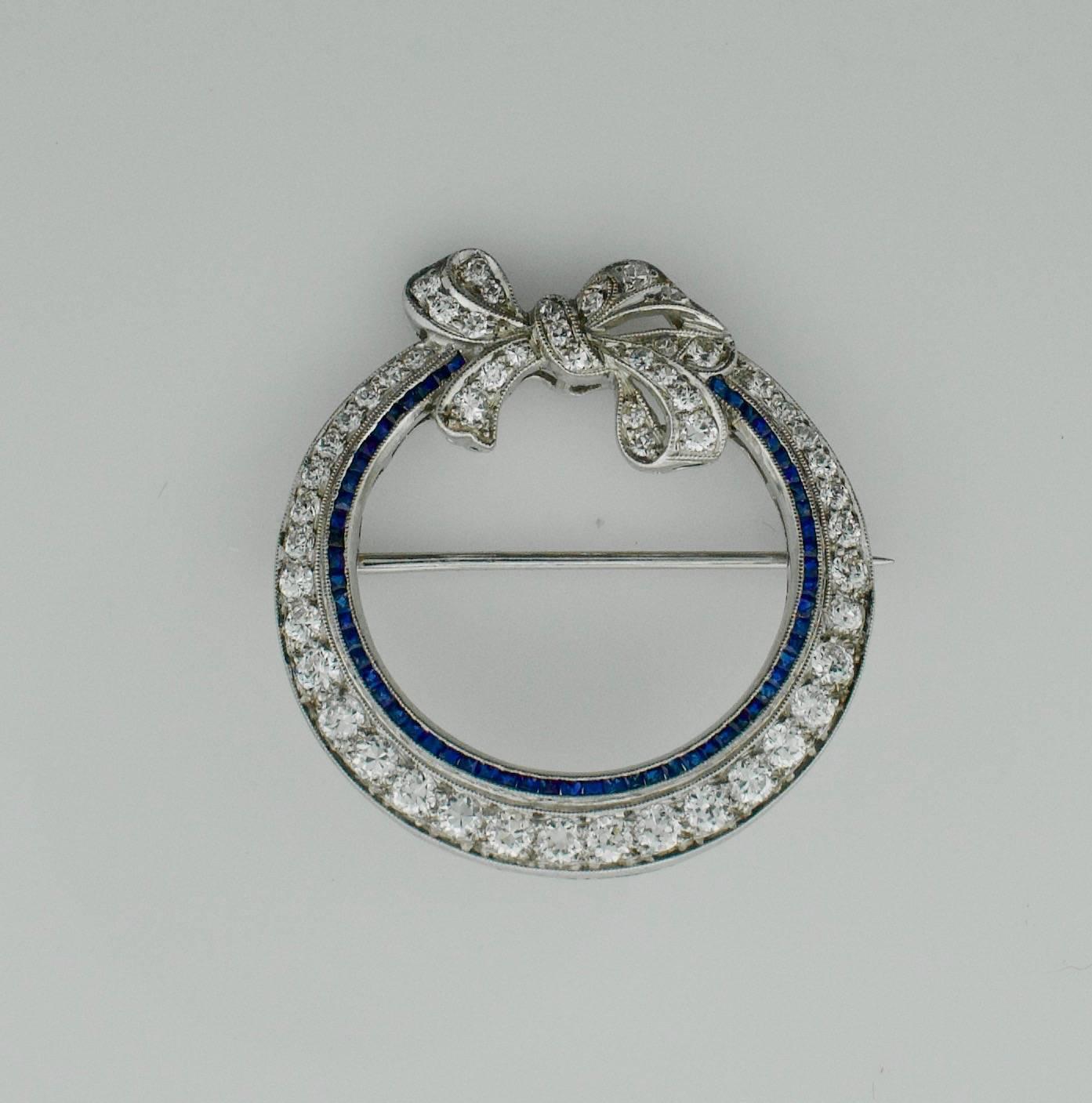 French Cut Art Deco Platinum Sapphire and Diamond Circle Brooch, circa 1920s