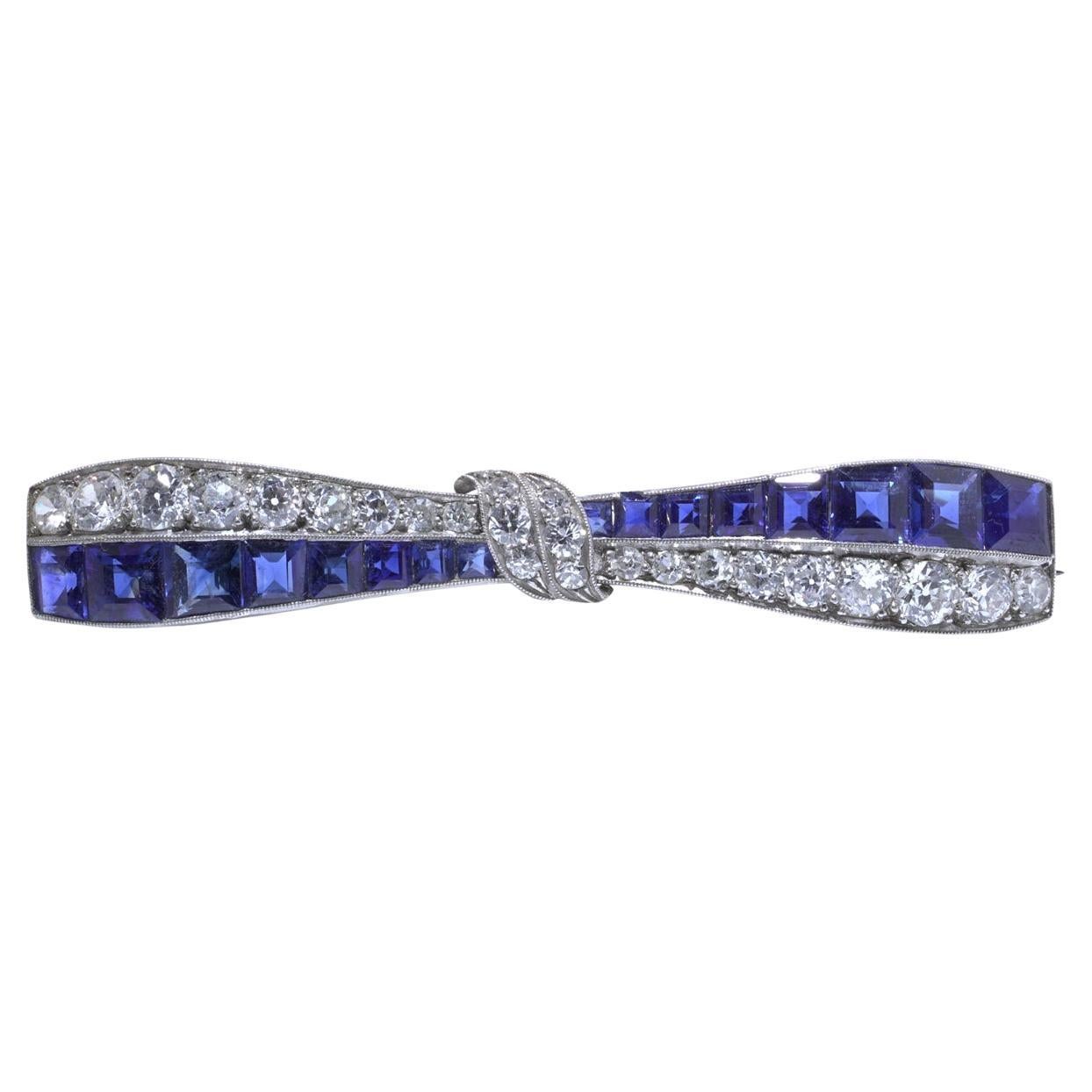 Art Deco Platinum Sapphire
Diamond Bow Brooch, c1920