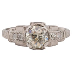 Bague de fiançailles vintage Art déco en platine avec solitaire géométrique gravé en arc de cercle