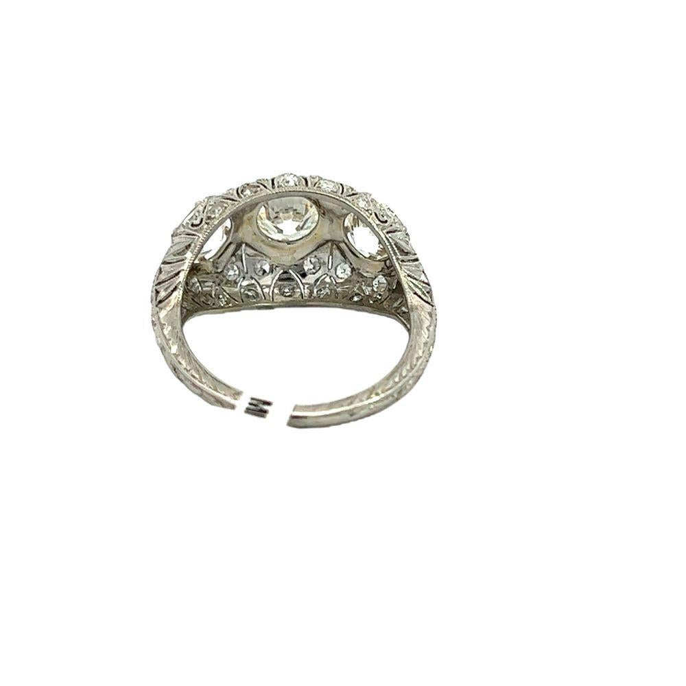 Original 1920s vintage Art Deco Platinum Three-Stone Diamond ring features old European diamonds, including a stunning center stone weighing 1.21 carats and two additional diamonds totaling 1.54 carats. The intricate fillagree and 6-prong setting
