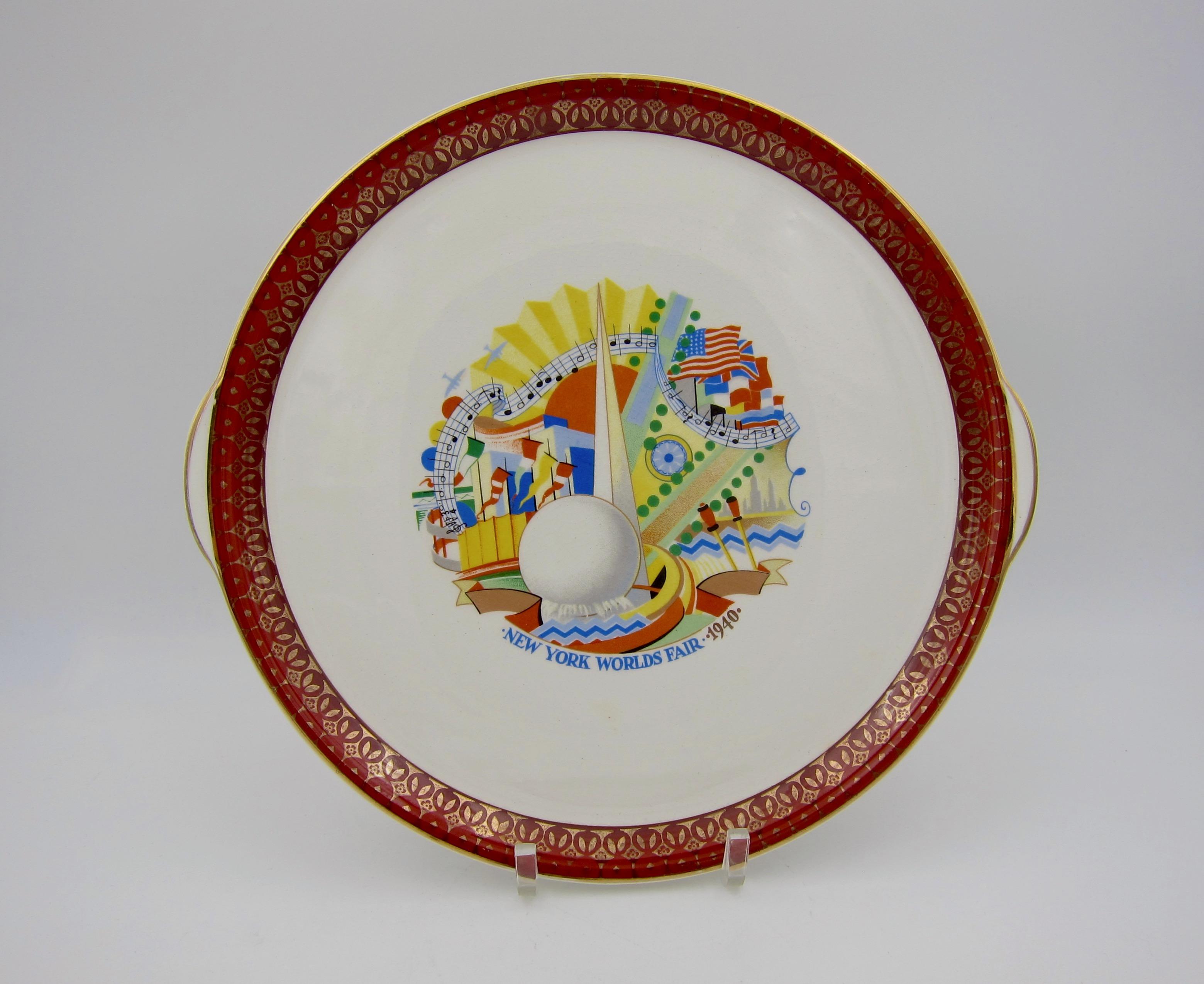 An Art Deco platter from the 1939-1940 New York World's Fair produced by The Cronin China Company of Minerva, Ohio (1934-1956) for the National Brotherhood of Operative Potters Exhibit. This vintage serving platter features a crisp and colorful