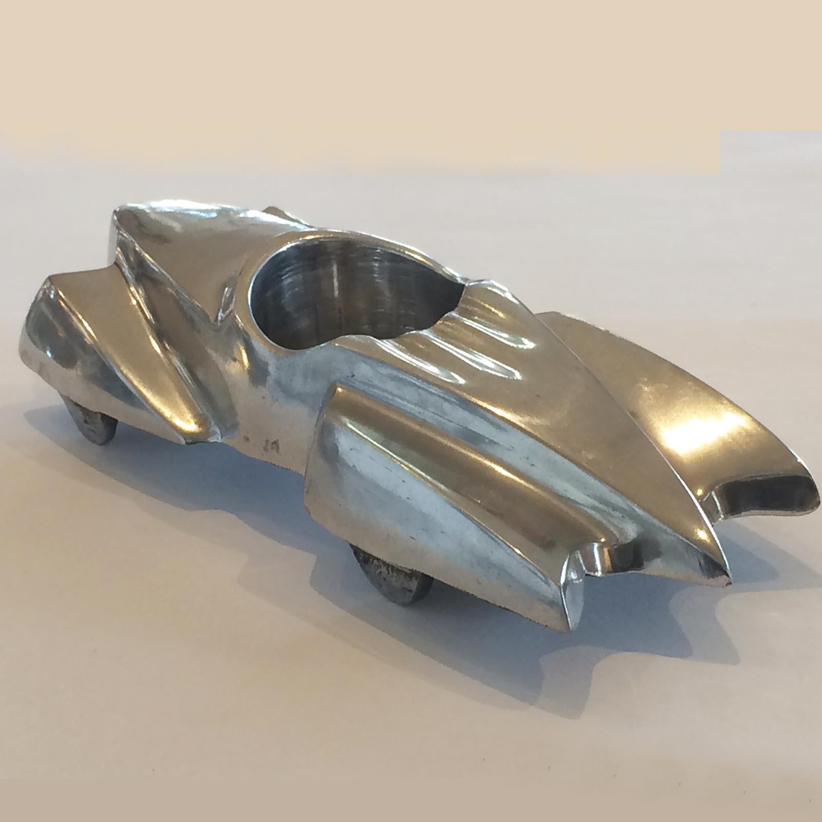 Art Deco polished aluminium car, pin, paperclip or ashtray. Fantastic streamlined shape, similar to the Cord Automobile of that time, U.S.A. All in excellent condition with no damage, no repairs or loses. Dimensions are approx.: 21cm long x 8cm wide