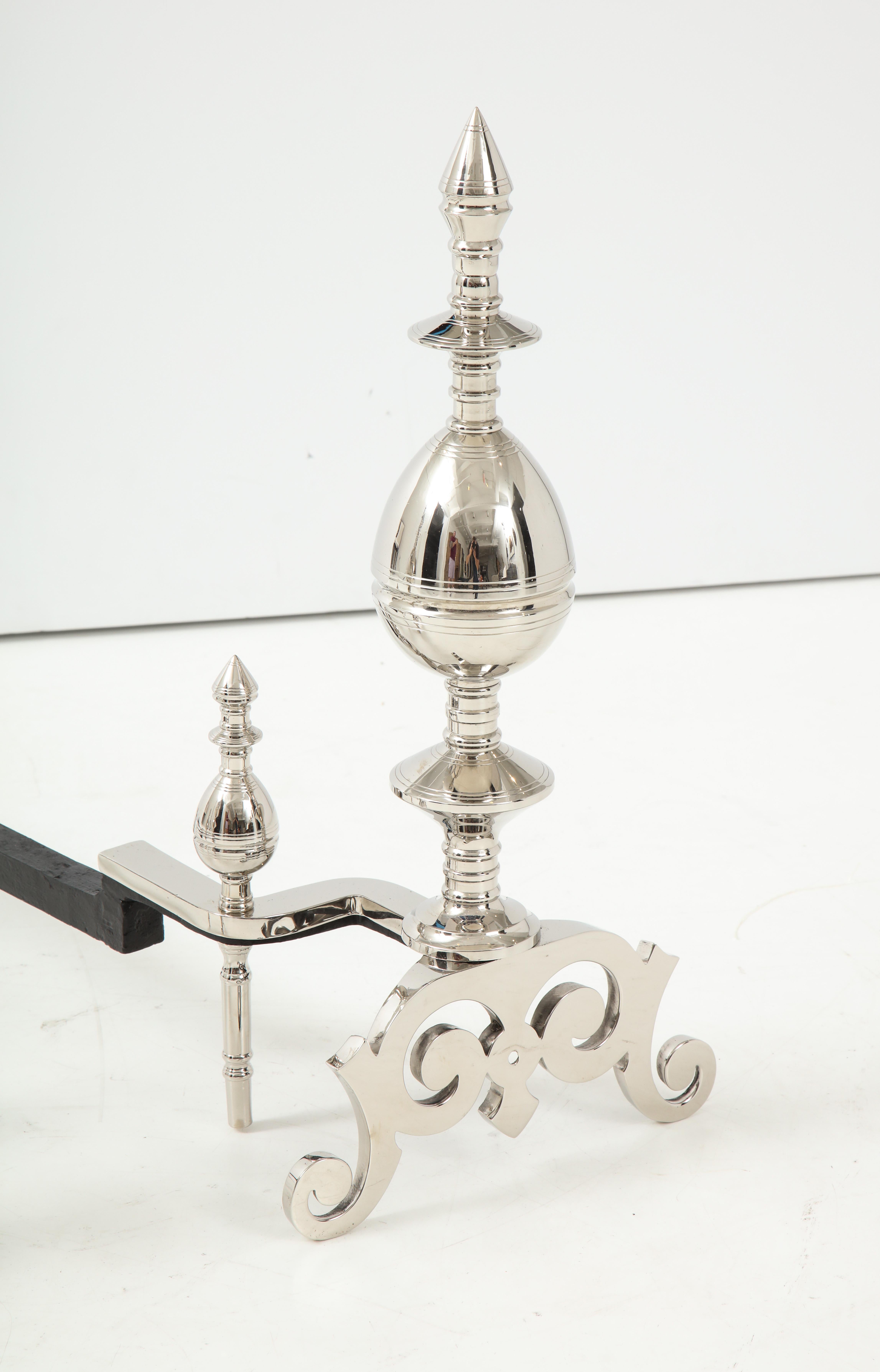 20th Century Art Deco Polished Nickel Spire Topped Andirons For Sale