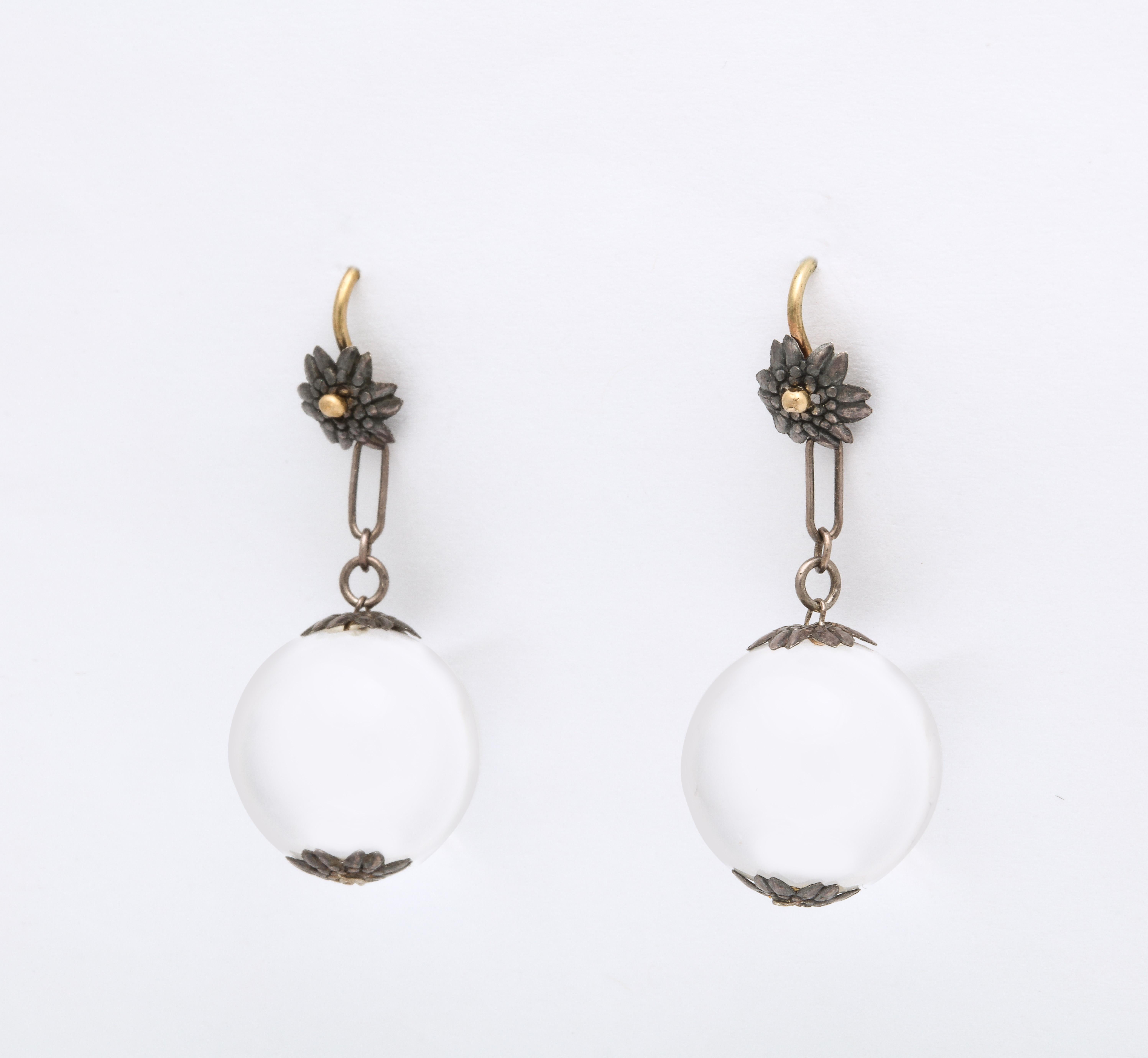 Pools of Light earrings are made without drilling holes in the crystal. The. belief is that crystal has spirit within and a hole would let that spirit out. These were worn from the late 19th century through the Art Deco period. Rock Crystal is pure