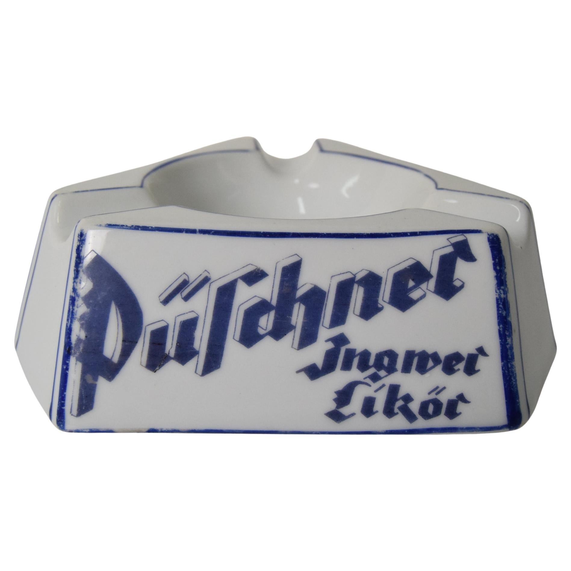 Cenicero publicitario de porcelana Art Decó Püschner Bitter, años 20.