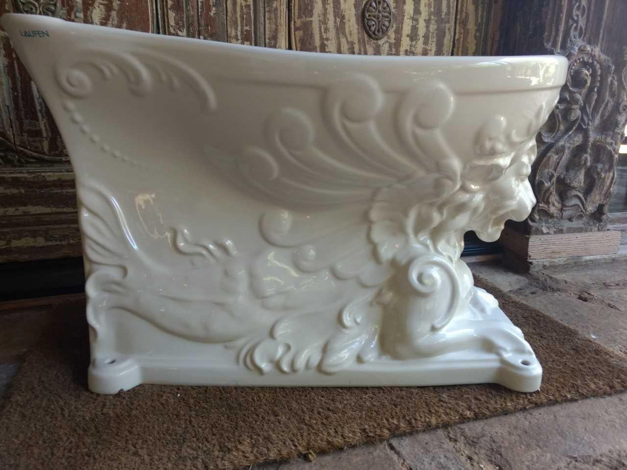 A rare and beautifully sculptured lion form Laufen Porcelain Bidet. Found still in its original packaging and box, immaculate condition.
Uses, planter, fountain, bidet or center piece.
We believe this to be a custom order as we have researched and