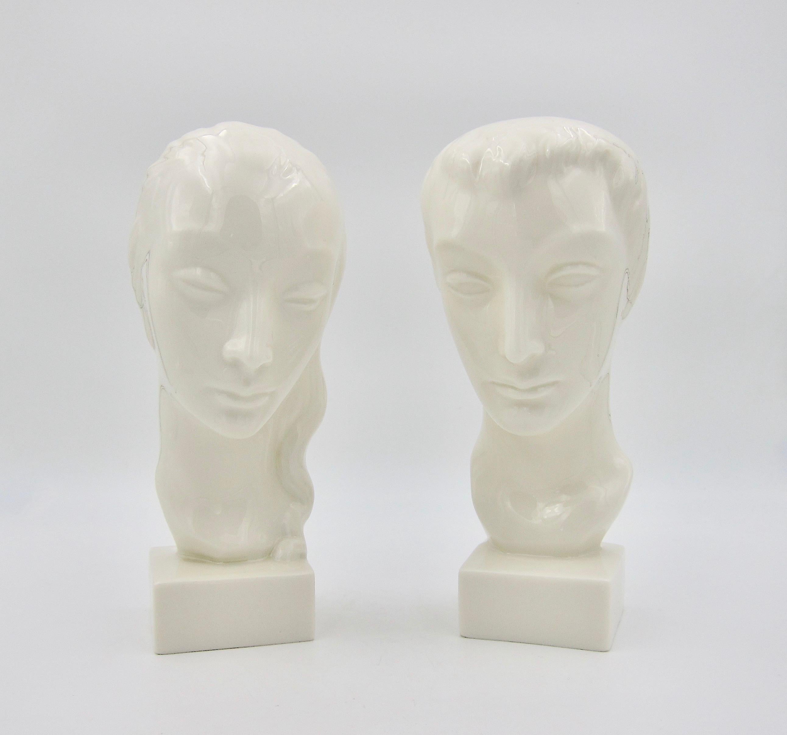 An American Art Deco bust pair designed by Geza de Vegh (1905-1989) for Lenox (formerly the Ceramic Art Company) of Trenton, New Jersey, dating circa 1930s. The stylized portrait busts of a man and woman were designed with delicate features and